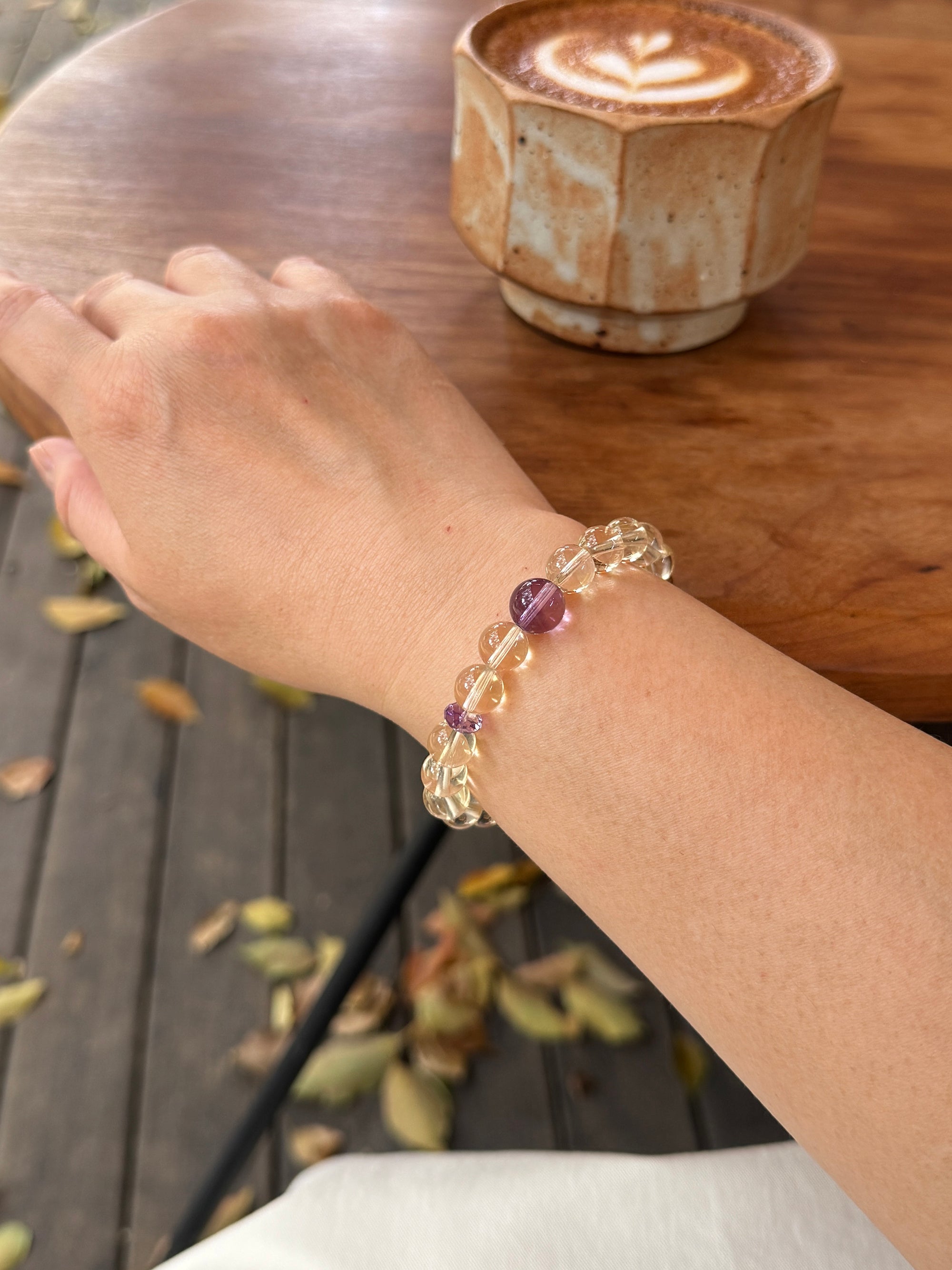 citrine crystal bracelet worn on wrist close-up showing size and fit