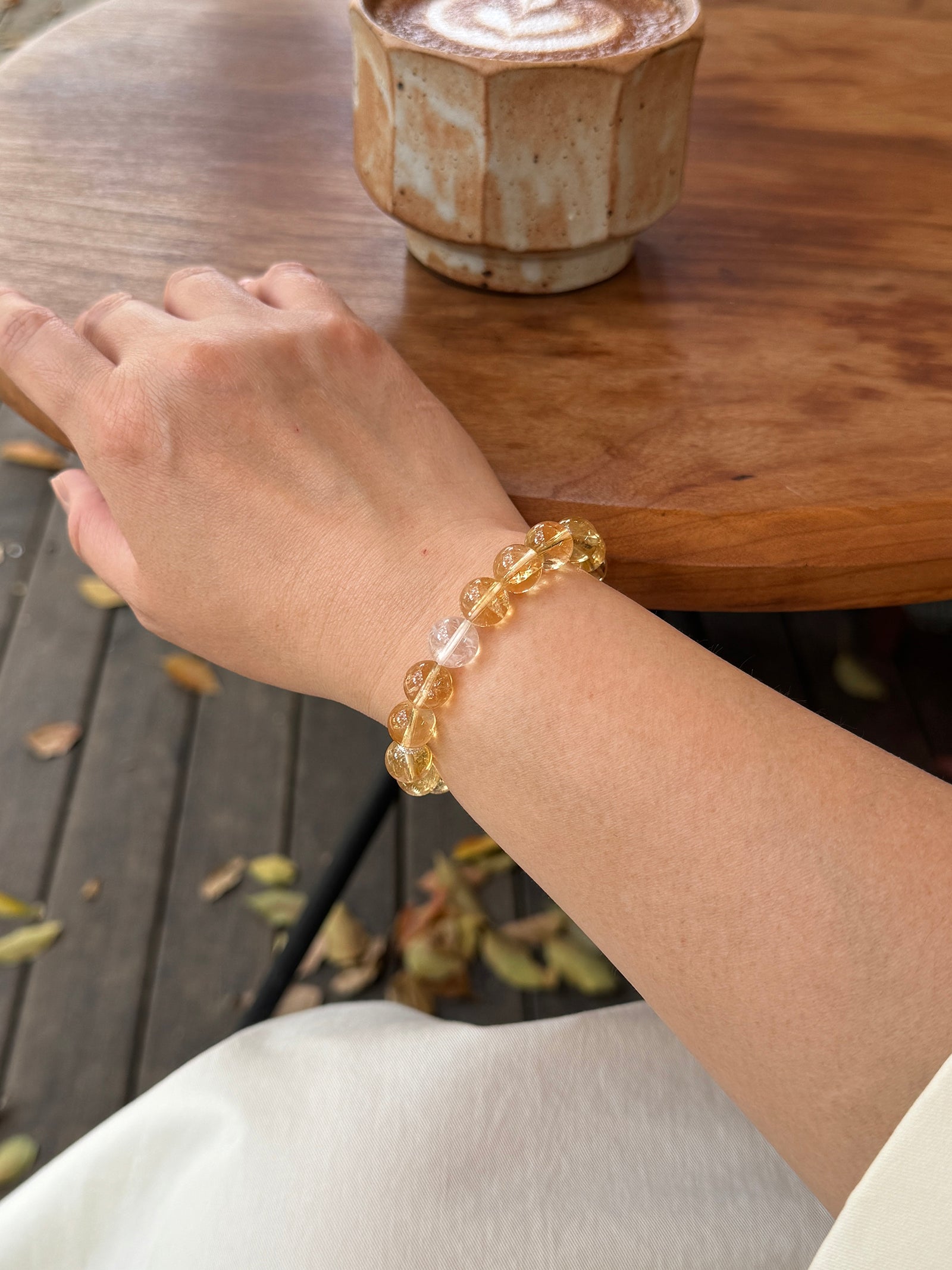 High-rainbow Citrine abundance  crystal bracelet worn on wrist close-up showing size and fit