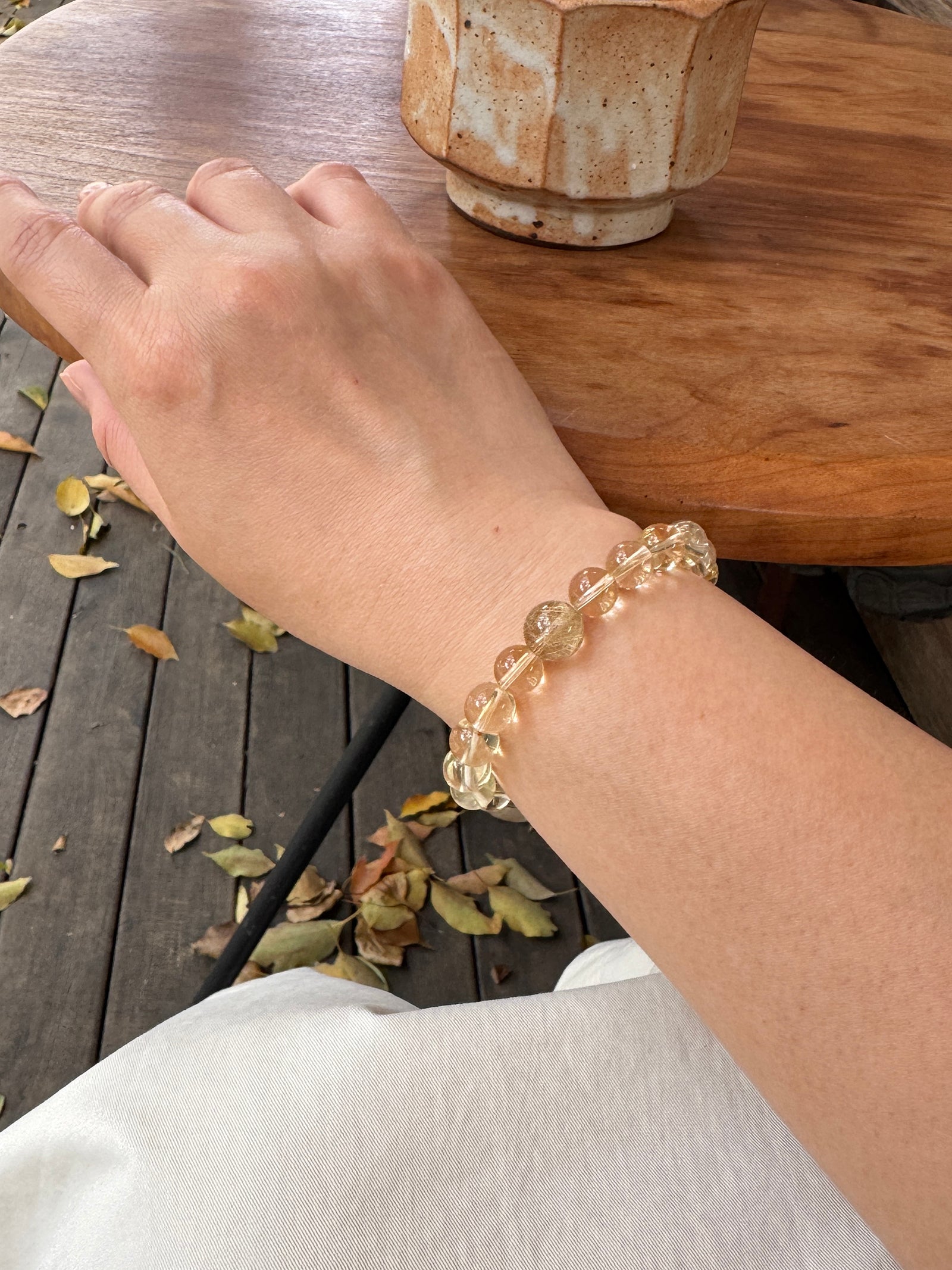 citrine crystal bracelet worn on wrist close-up showing size and fit