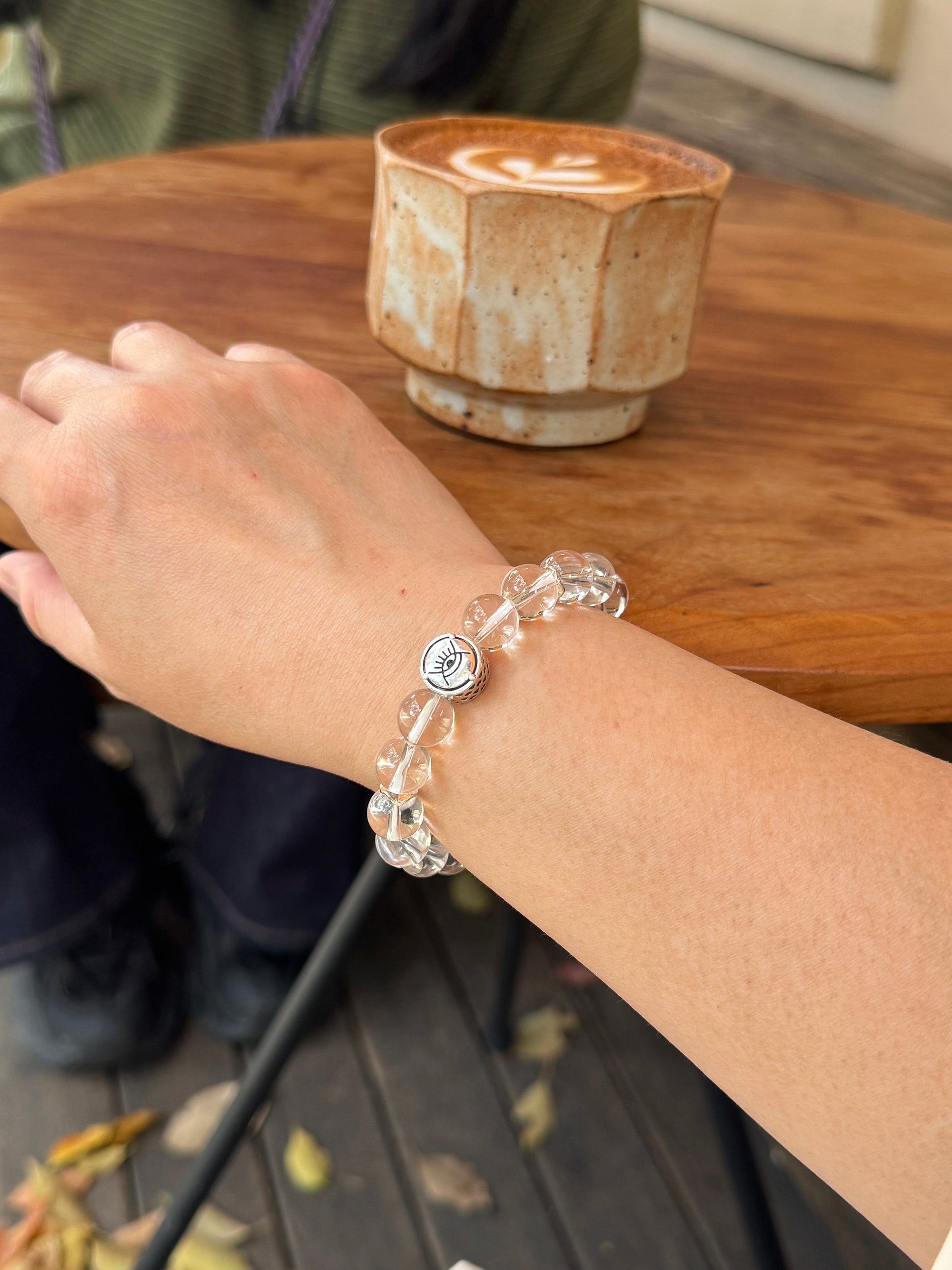 Clear quartz crystal bracelet worn on wrist close-up for renewal and emotional balance