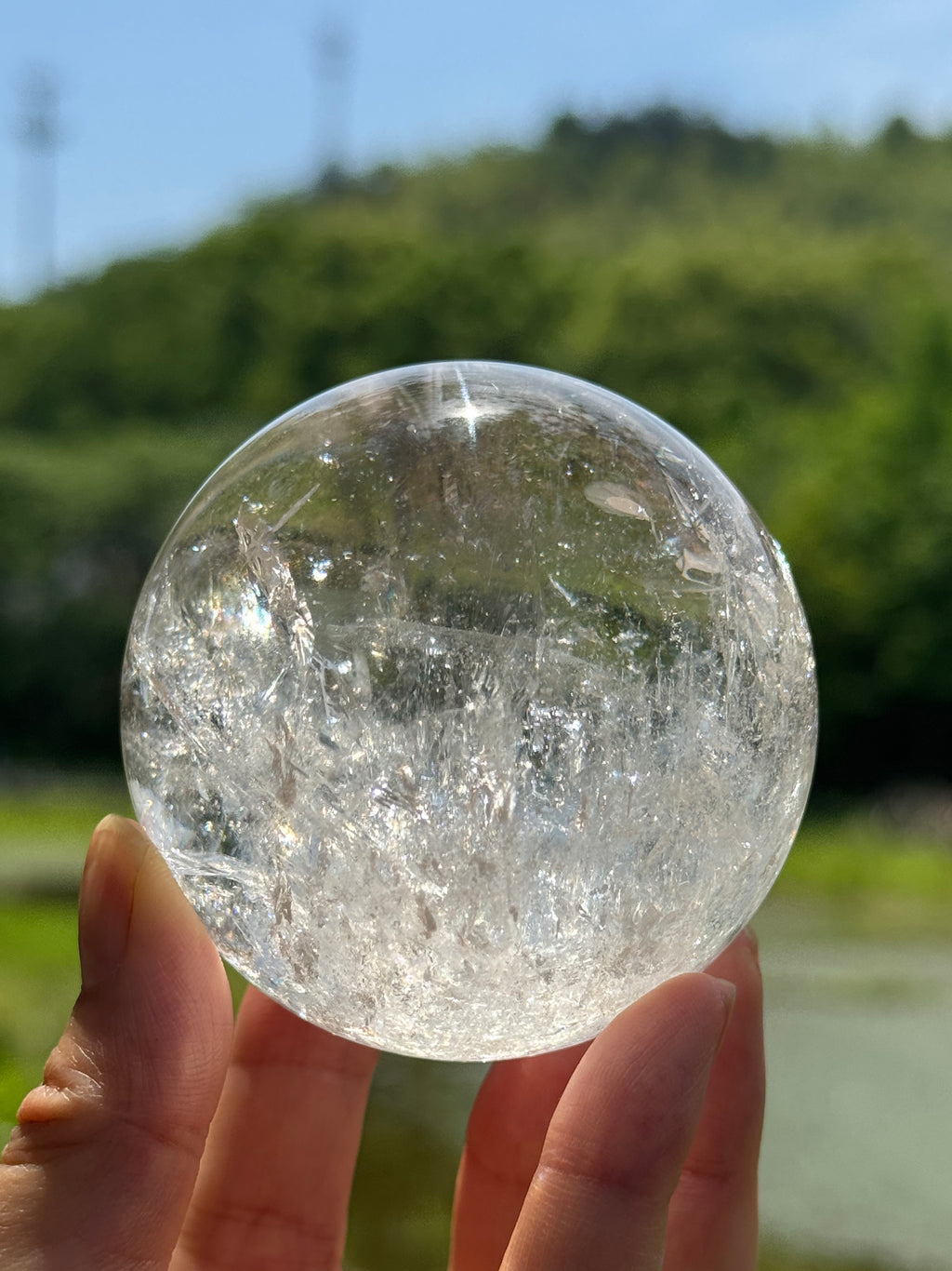 clear-quartz-sphere-held-in-sunlight.jpg