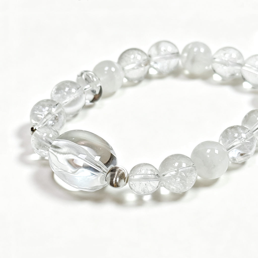Close-up detail of Clear Quartz and White Phantom Quartz bracelet showing natural rainbow textures and phantom formations