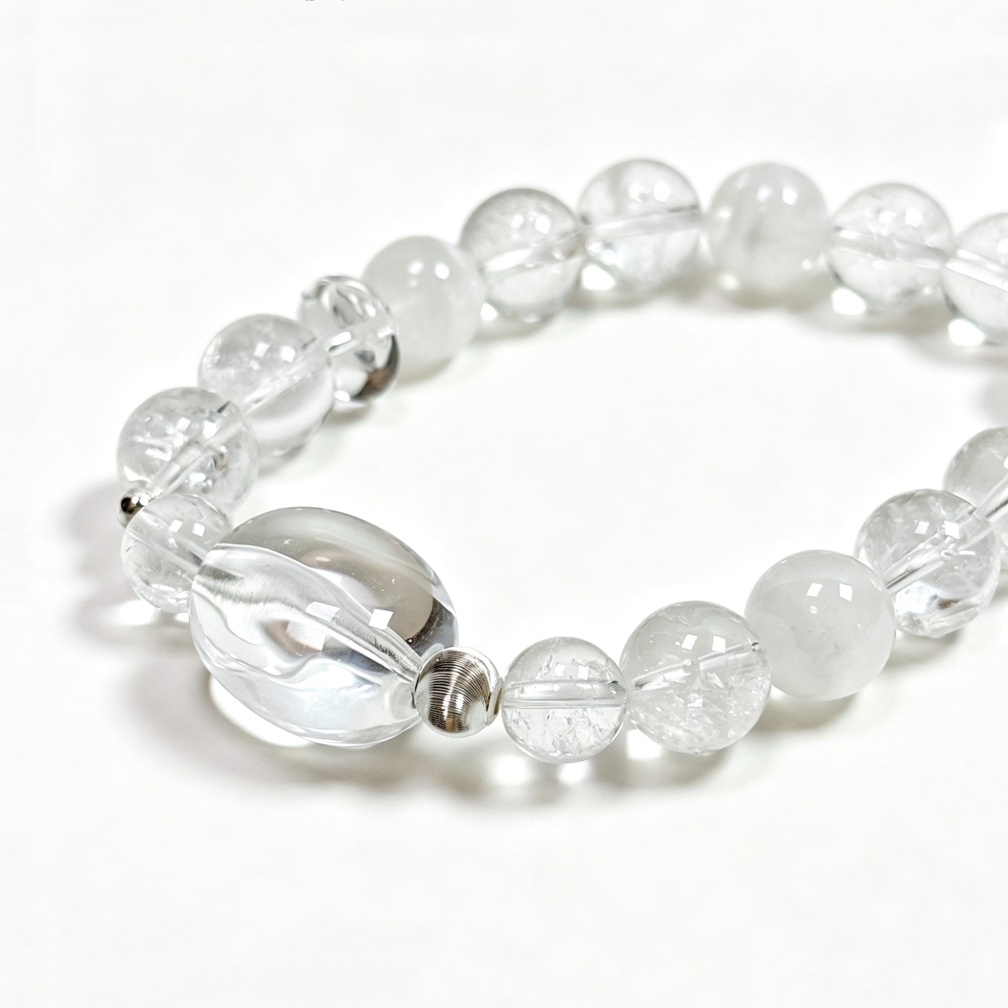 Close-up detail of Clear Quartz and White Phantom Quartz bracelet showing natural rainbow textures and phantom formations