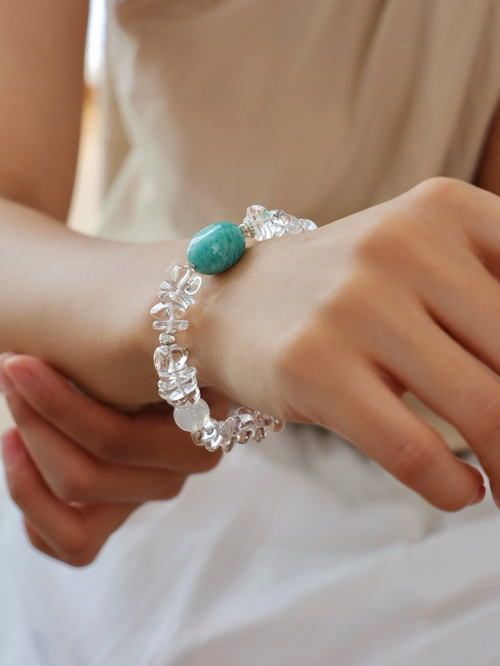 Collector-grade Clear Quartz, Amazonite and freshwater pearl bracelet worn on wrist