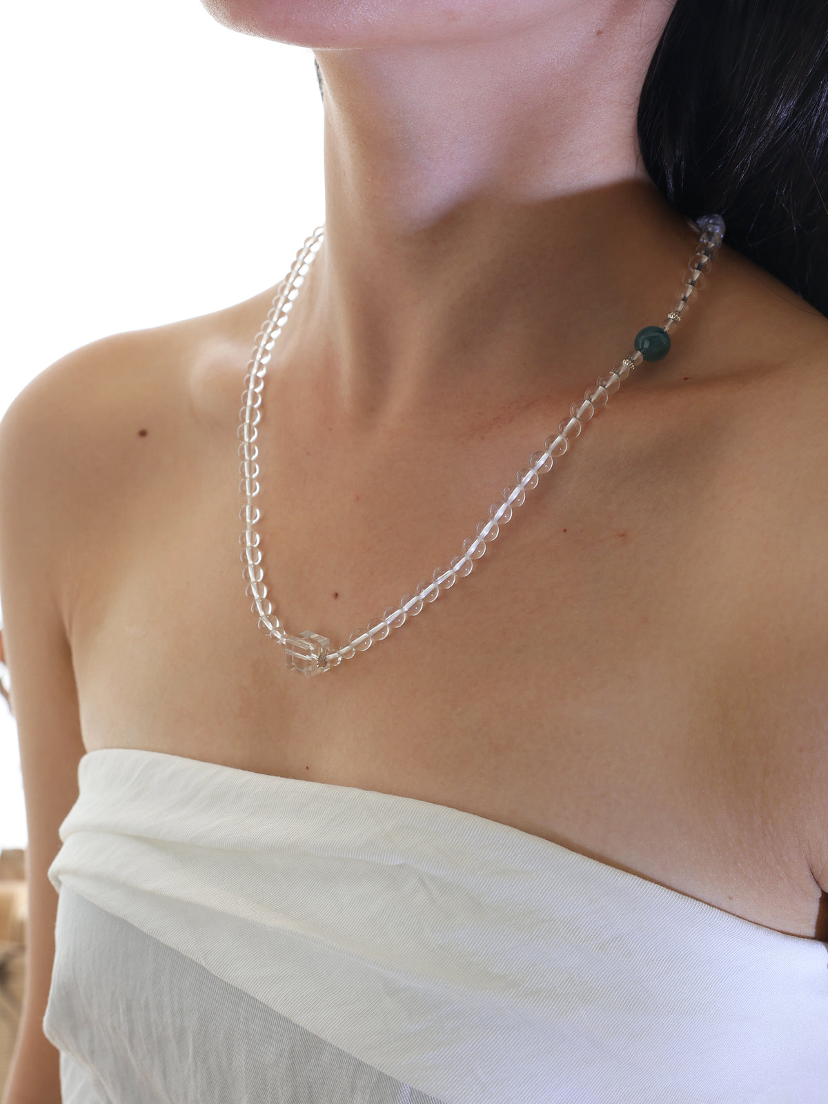 Model wearing a collector-grade Clear Quartz and Monet Blue-Green Kyanite single-strand necklace with 925 sterling silver.