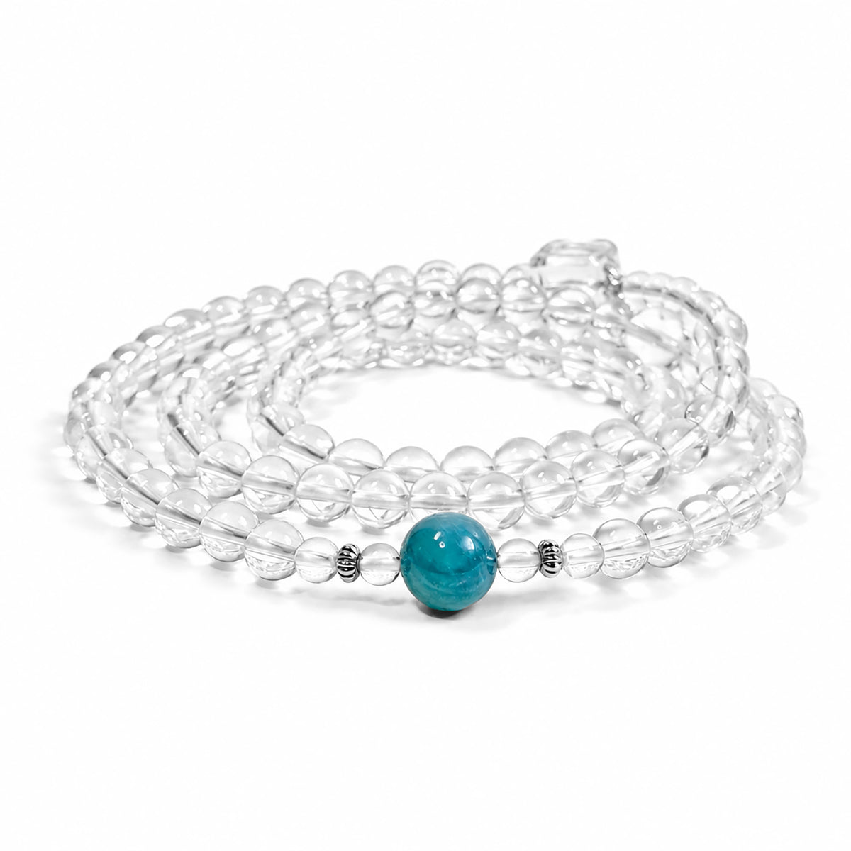 Side view of a collector-grade Clear Quartz and Monet Blue-Green Kyanite convertible necklace and bracelet with 925 sterling silver on a white background.