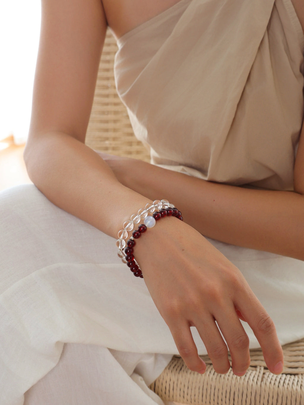 Model wearing a natural Deep Burgundy Garnet and Moonstone bracelet