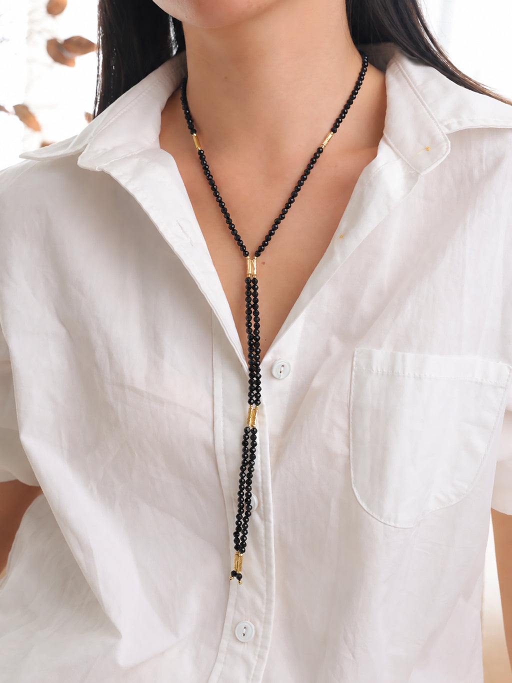 Natural undyed faceted Black Spinel convertible necklace styled for a refined professional look.