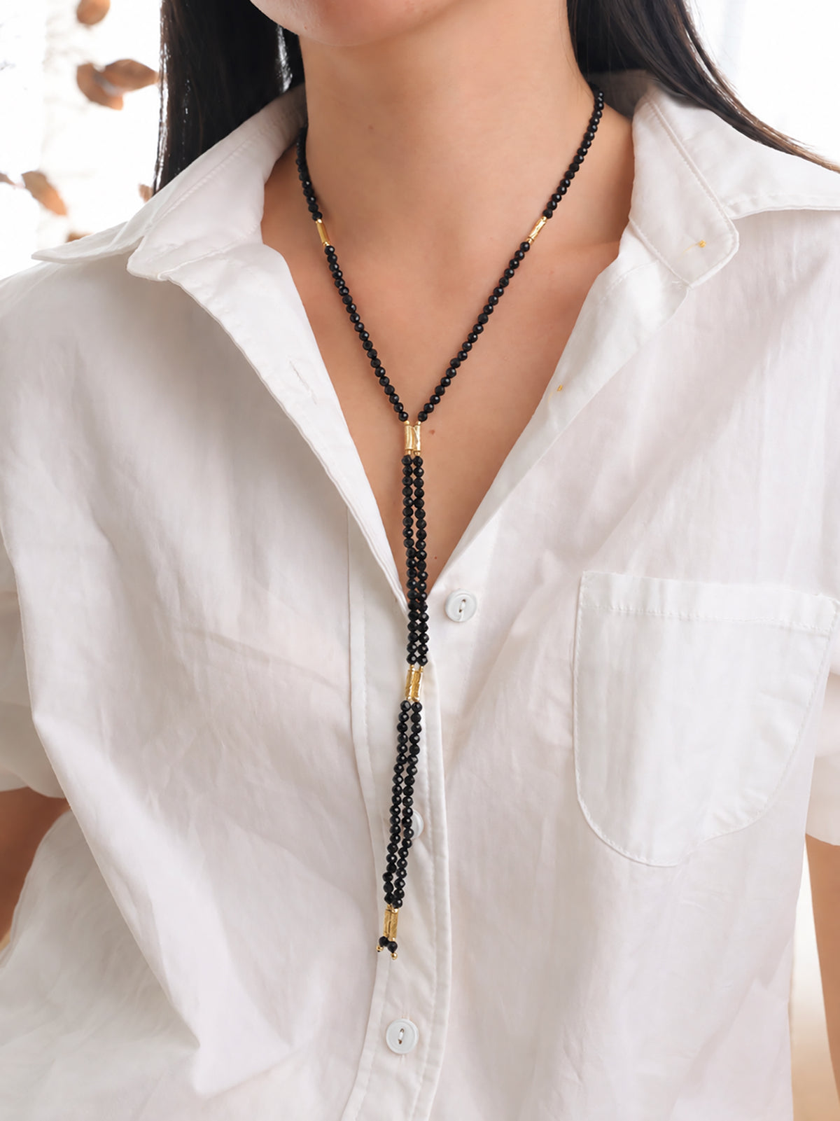 Natural undyed faceted Black Spinel convertible necklace styled for a refined professional look.
