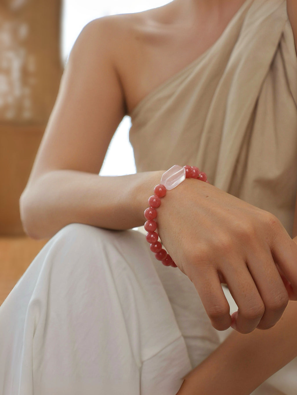 Fine Rhodochrosite and Fine Rose Quartz bracelet worn on wrist