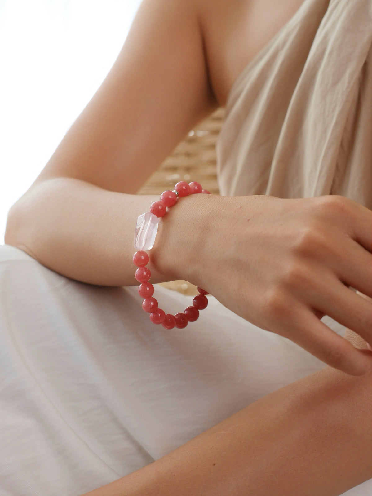 Fine Rhodochrosite and Fine Rose Quartz bracelet worn on wrist
