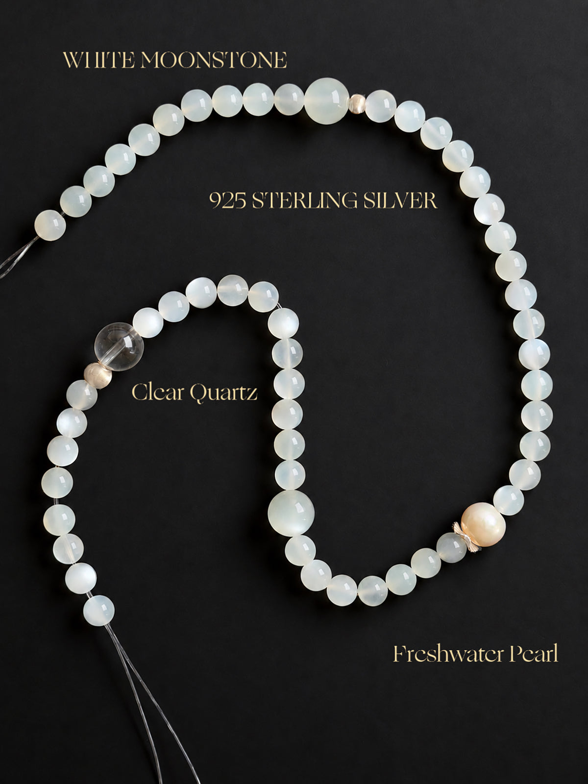 Fine White Moonstone, Clear Quartz and Freshwater Pearl double wrap bracelet displayed against a black background, highlighting the natural gemstone textures, translucency, pearlescent luster and delicate details.