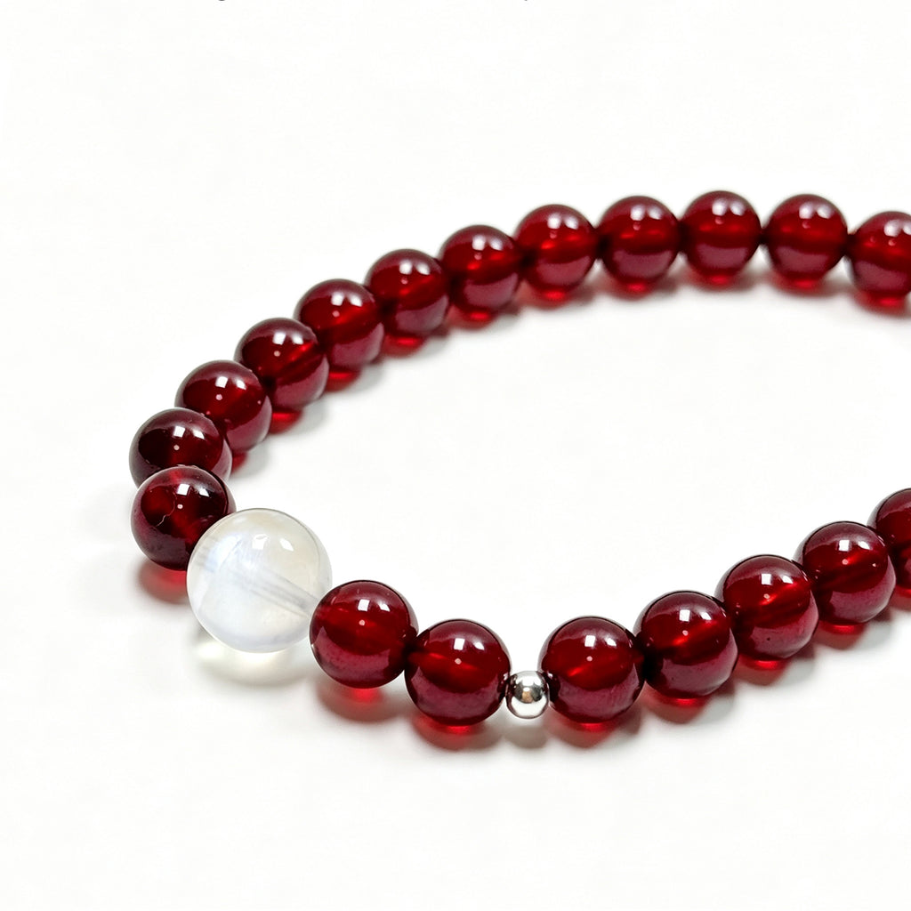 Close-up detail of garnet crystal bracelet showing natural stone texture