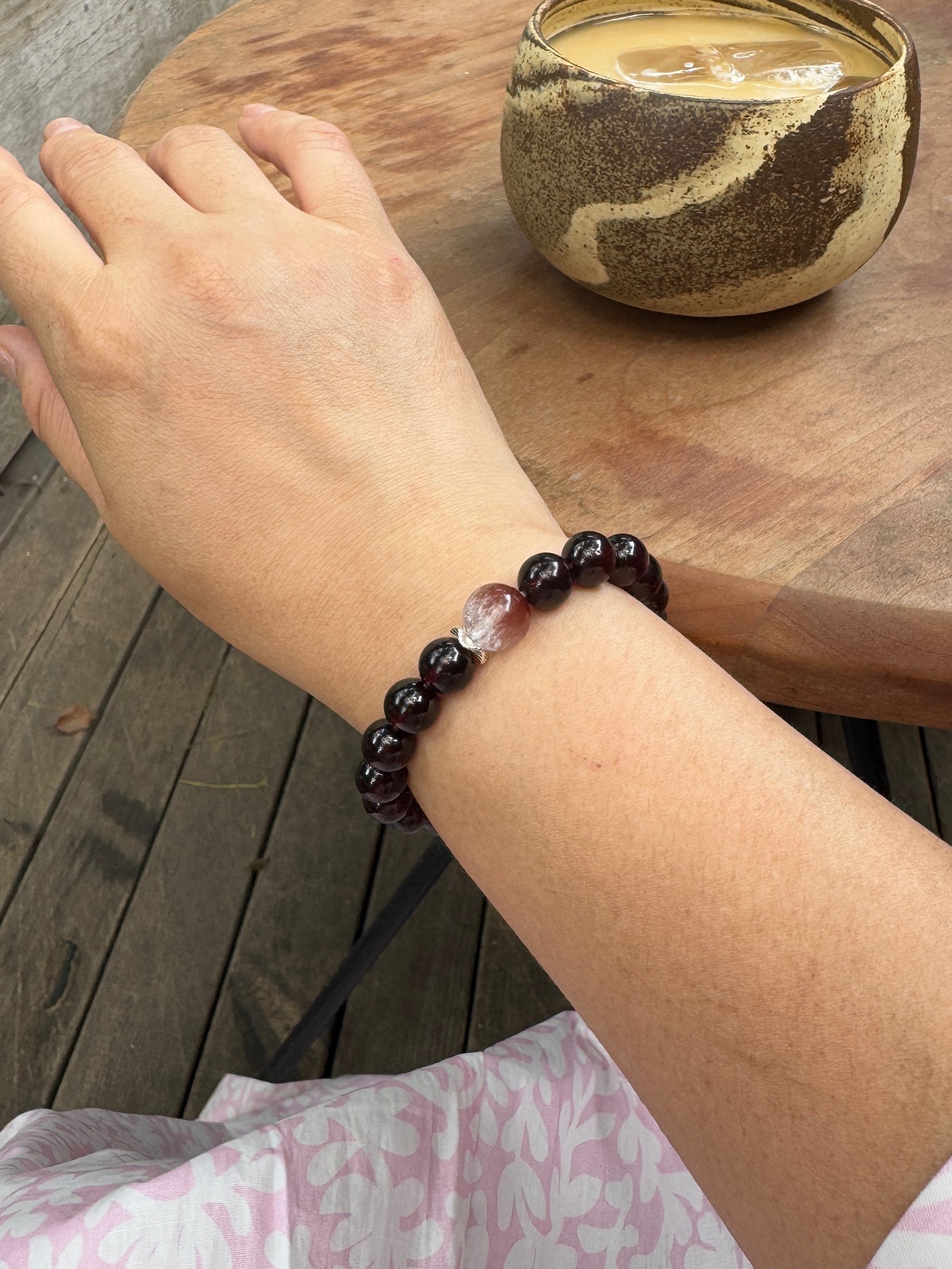 Garnet and pink rabbit hair quartz bracelet worn on wrist showing size and fit