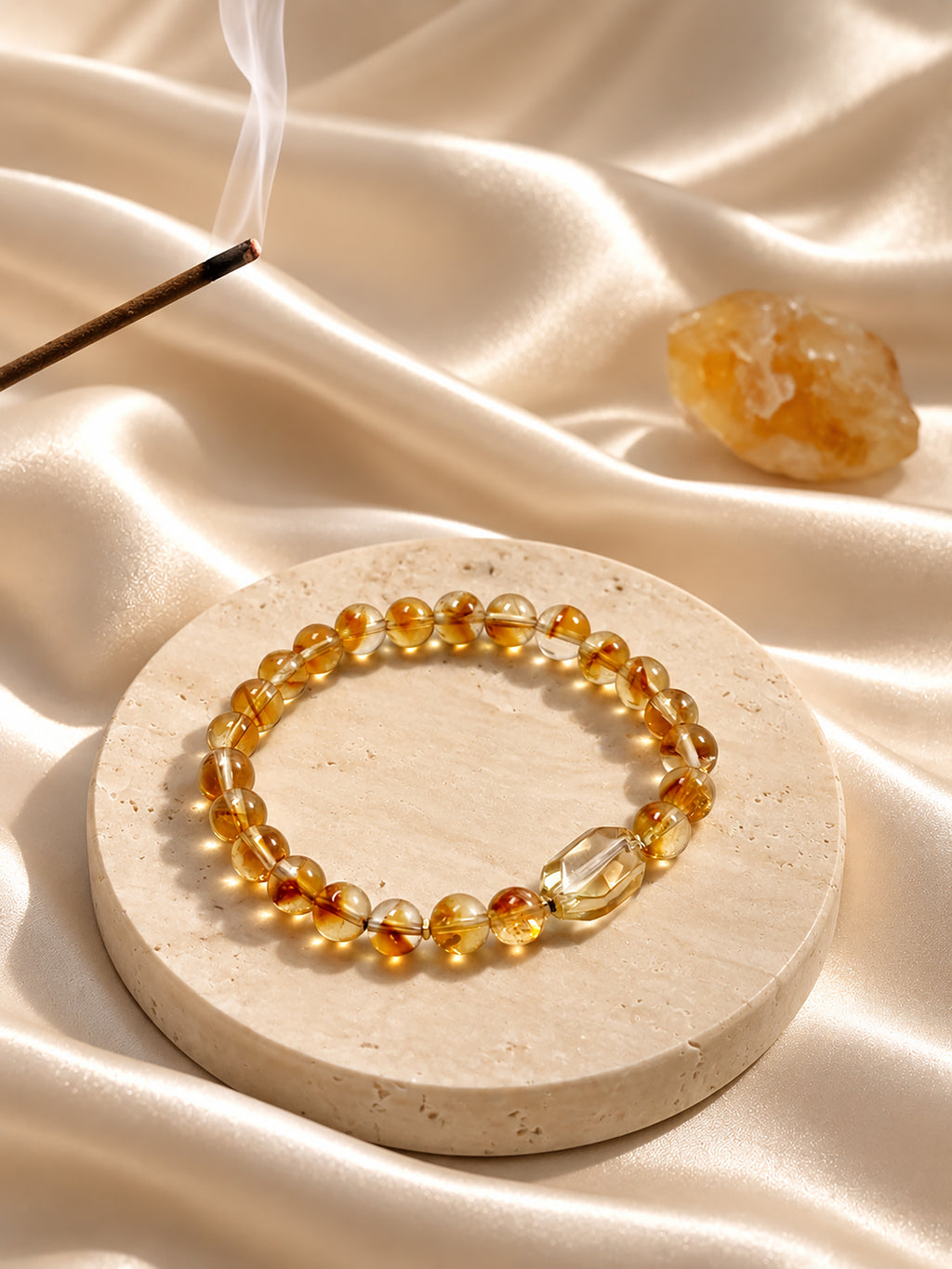 Golden healer Quartz bracelet styled on meditation altar with calming spiritual objects