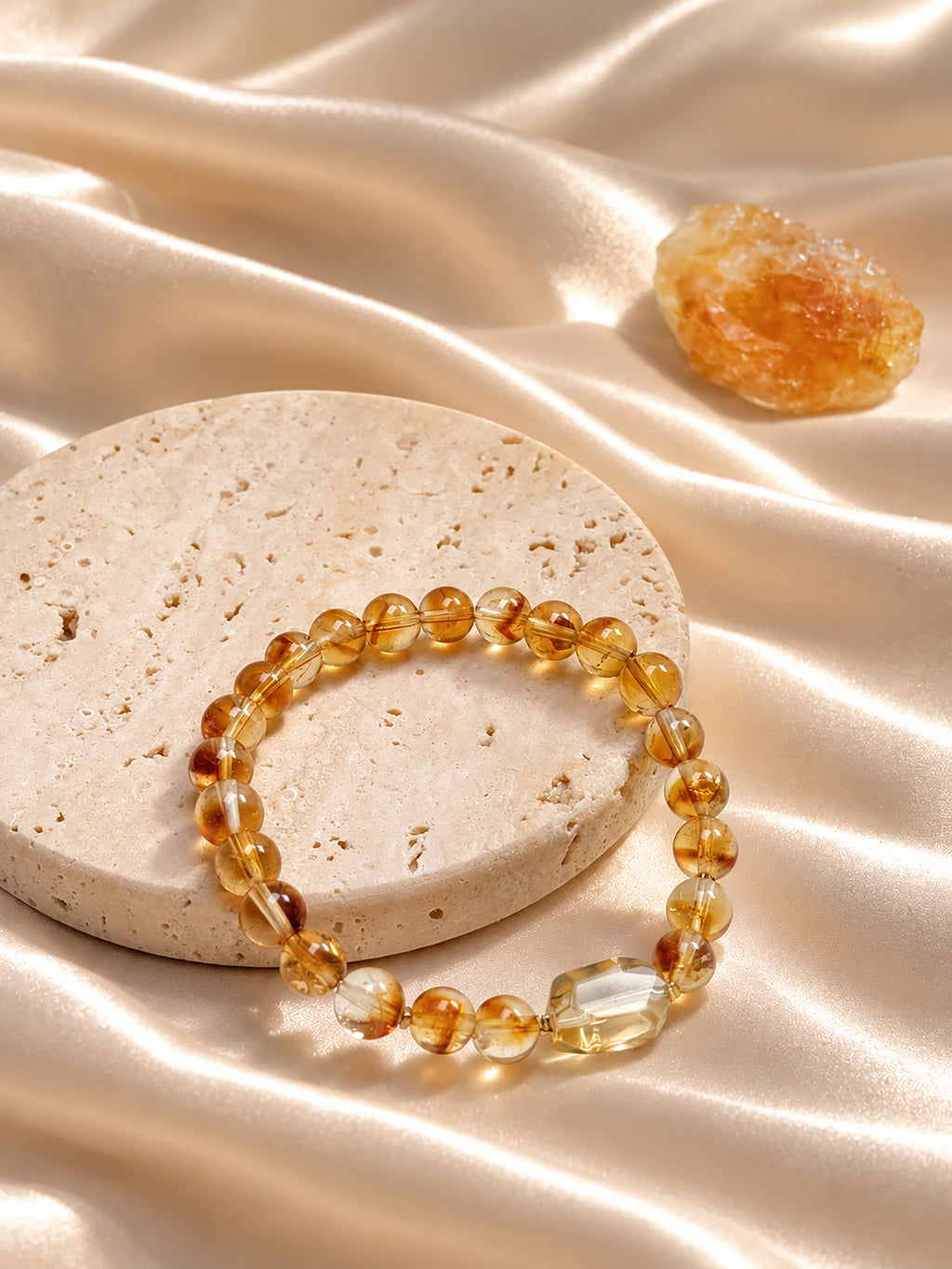 Golden healer Quartz bracelet styled on meditation altar with calming spiritual objects
