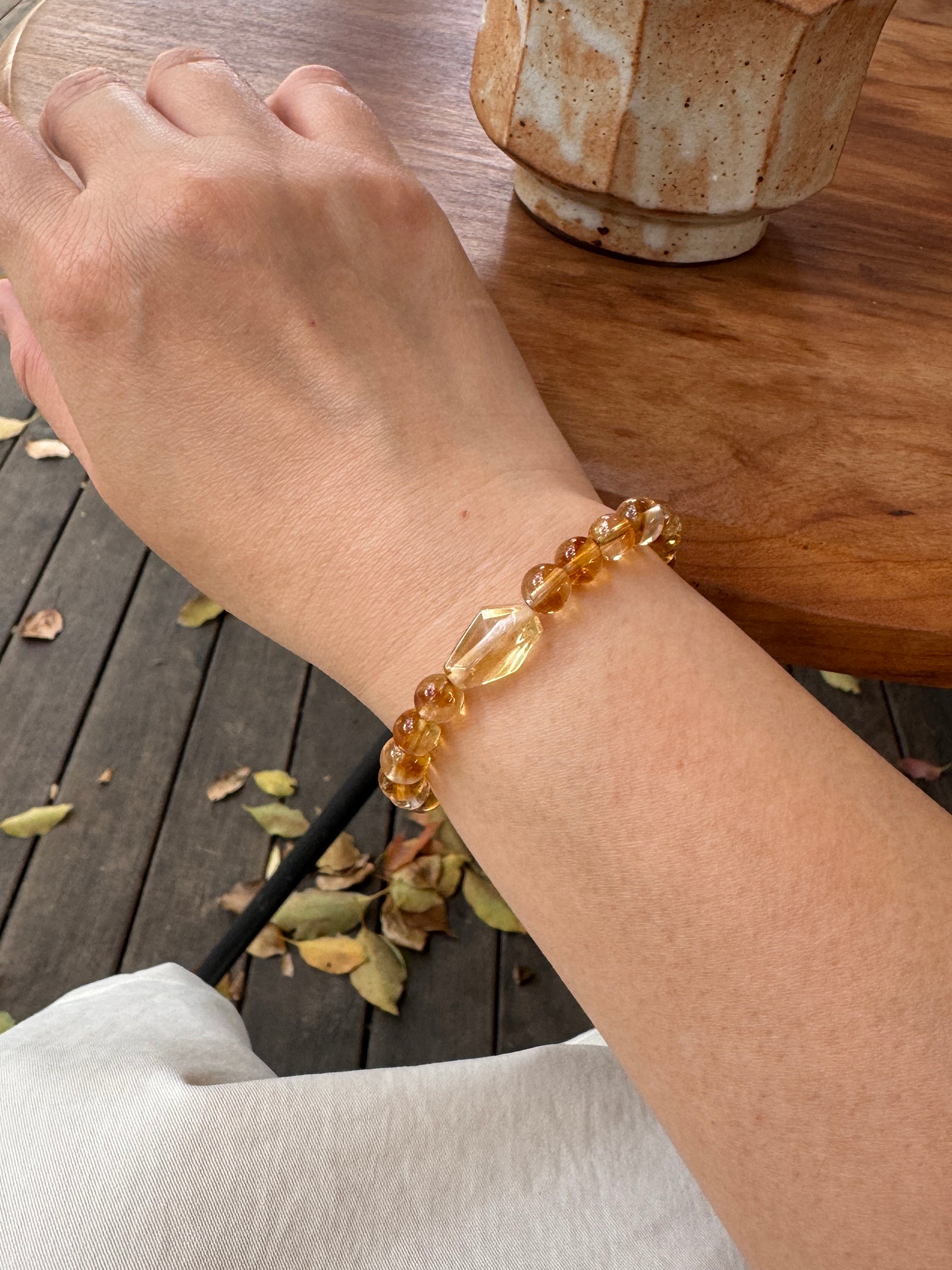 Golden healer Quartz crystal bracelet worn on wrist close-up showing size and fit