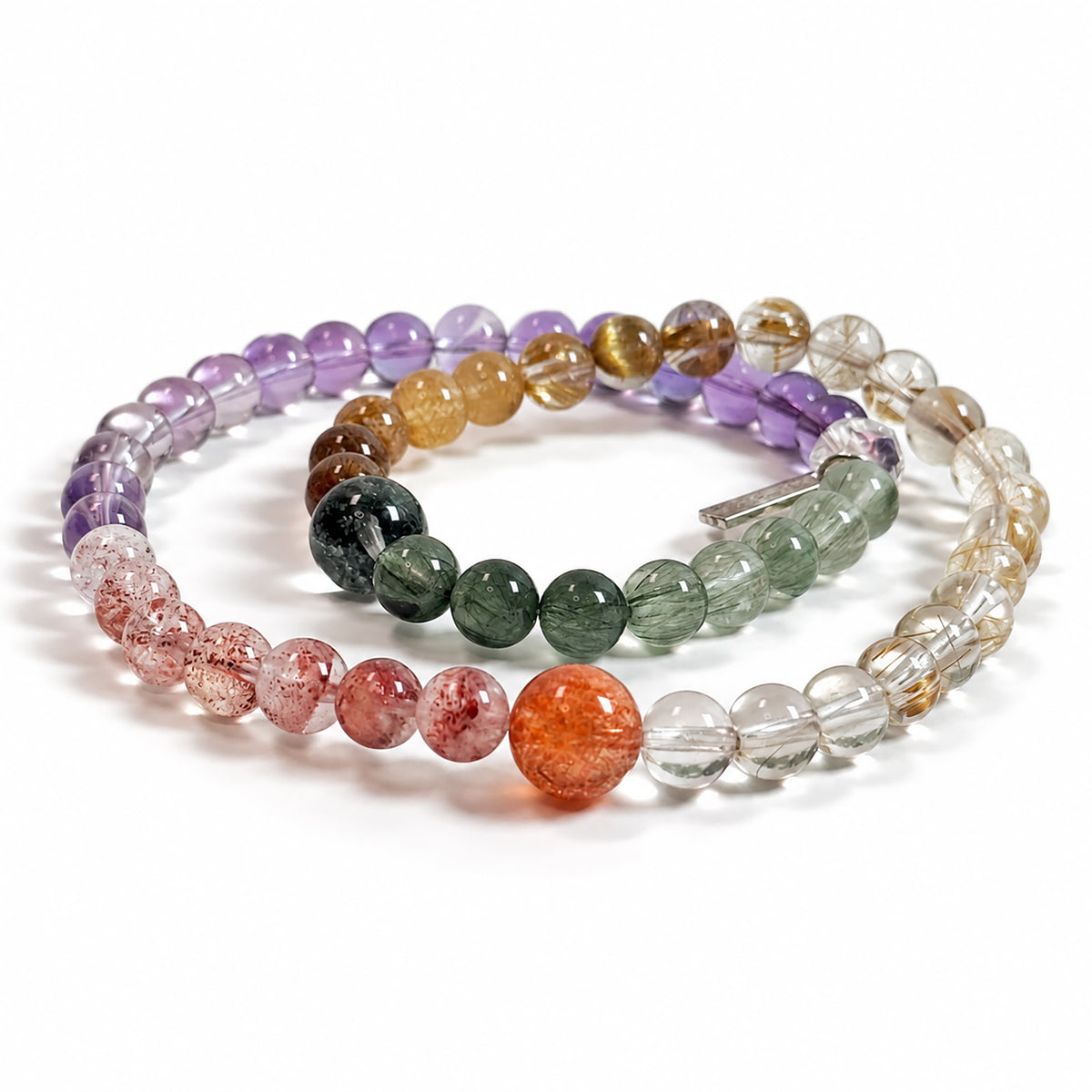 Side view of Four Seasons in Miniature bracelet featuring natural Golden Strawberry Quartz, Golden Sunstone, Citrine, Golden Rutilated Quartz, Copper Rutilated Quartz, Green Phantom Quartz, Green Rutilated Quartz, Amethyst, and Clear Quartz.