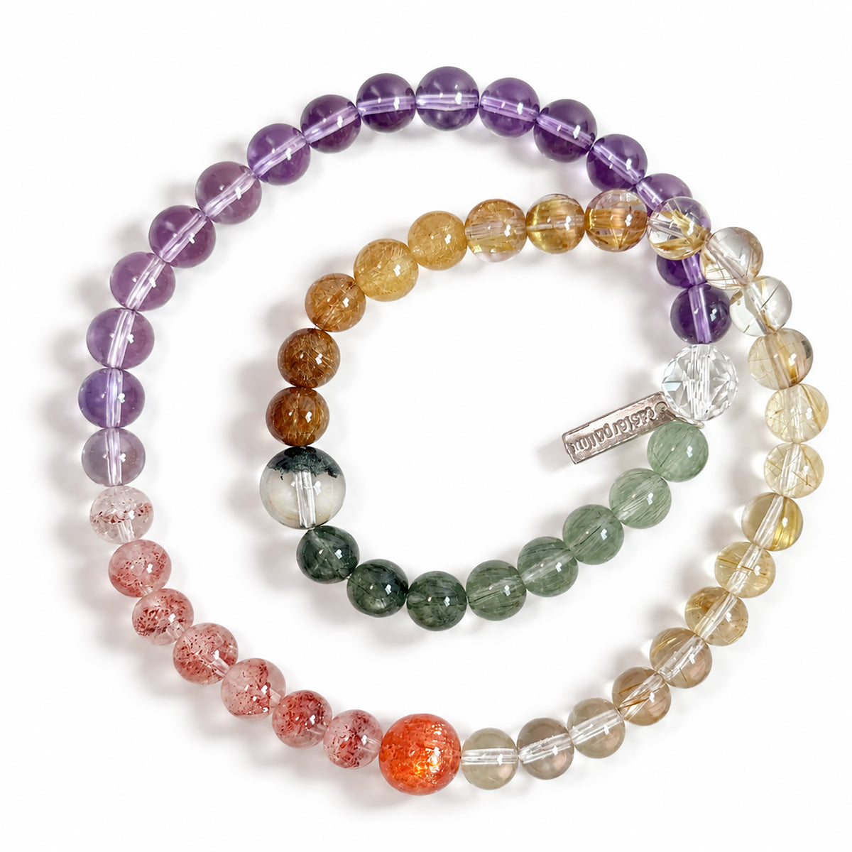 Top view of Four Seasons in Miniature bracelet showing the arrangement of Golden Strawberry Quartz, Golden Sunstone, Citrine, Golden Rutilated Quartz, Copper Rutilated Quartz, Green Phantom Quartz, Green Rutilated Quartz, Amethyst, and Clear Quartz.
