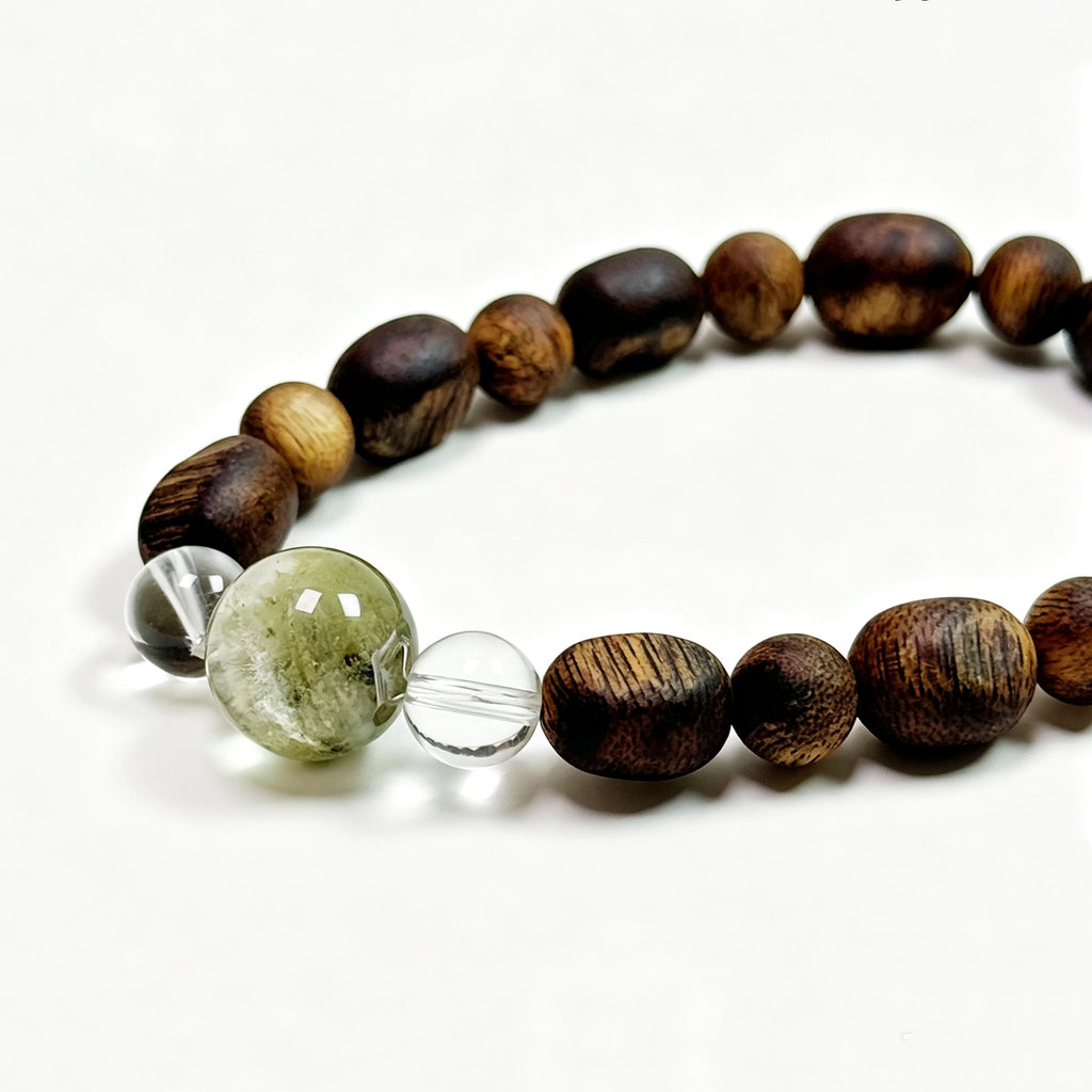
Close-up detail of Green Phantom and Natural Agarwood bracelet showing natural crystal and wood texture