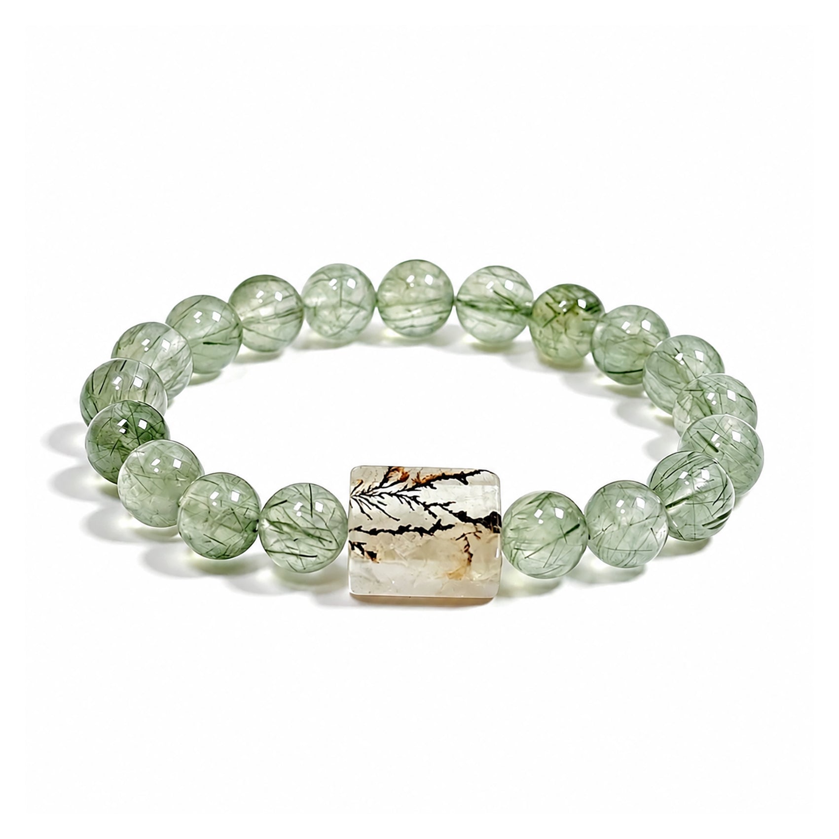 Green rutilated quartz bracelet with natural scenic stone charm on white background