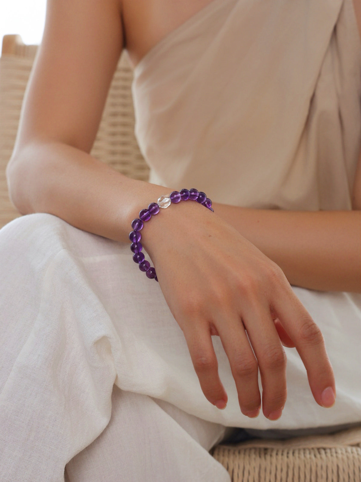 Model wearing a natural High-Clarity Amethyst bracelet