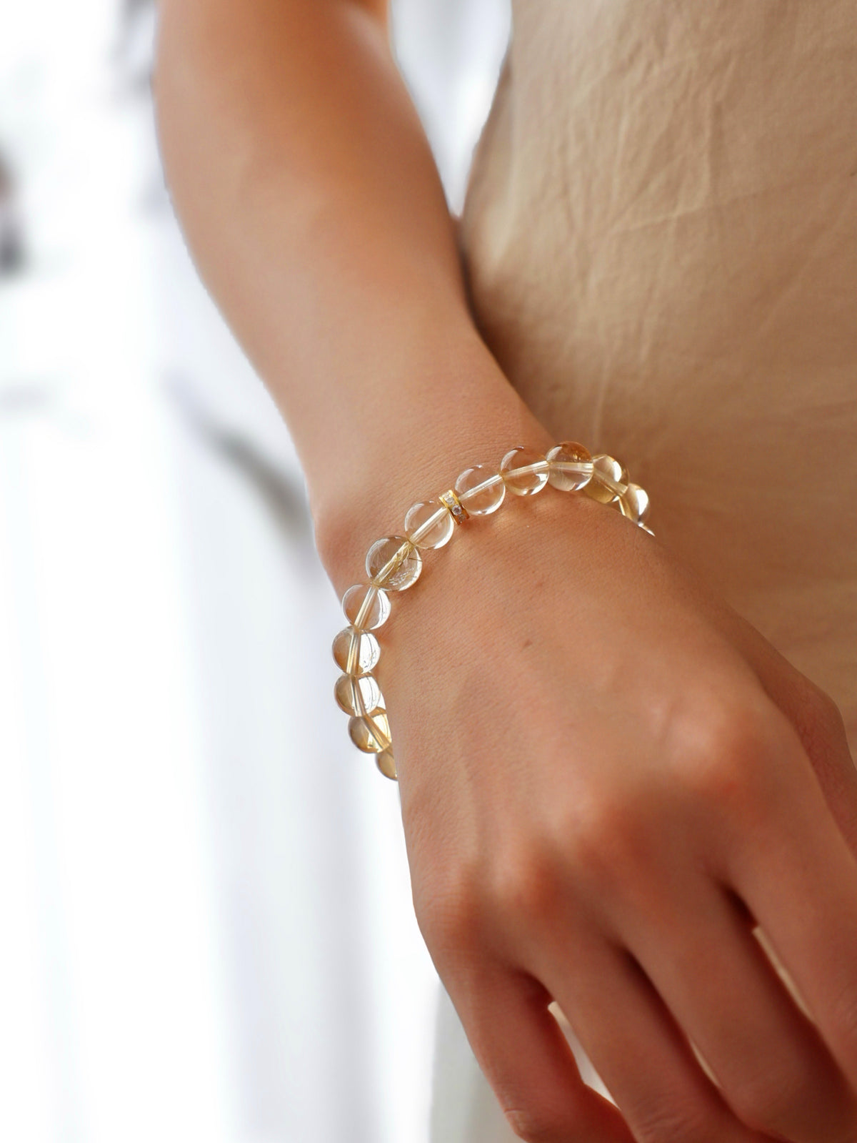 High-clarity Citrine and Golden Rutilated Quartz bracelet worn on wrist