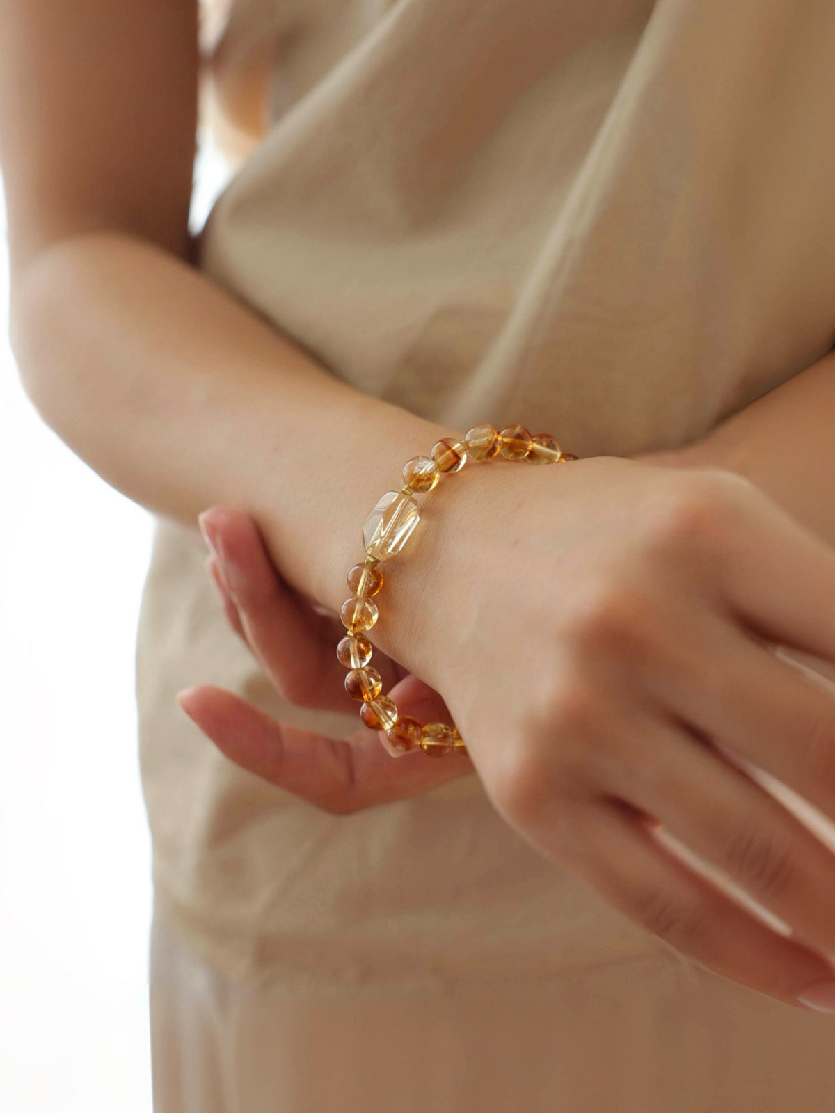 High-clarity Citrine and Golden Rutilated Quartz bracelet worn on wrist