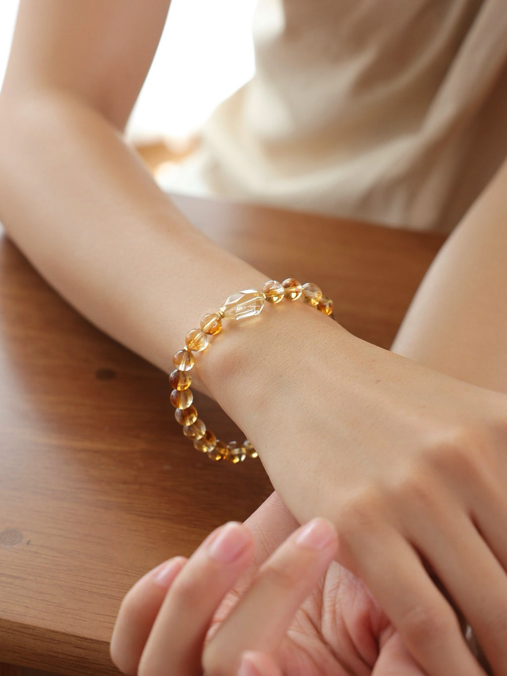 High-clarity Citrine and Golden Rutilated Quartz bracelet worn on wrist