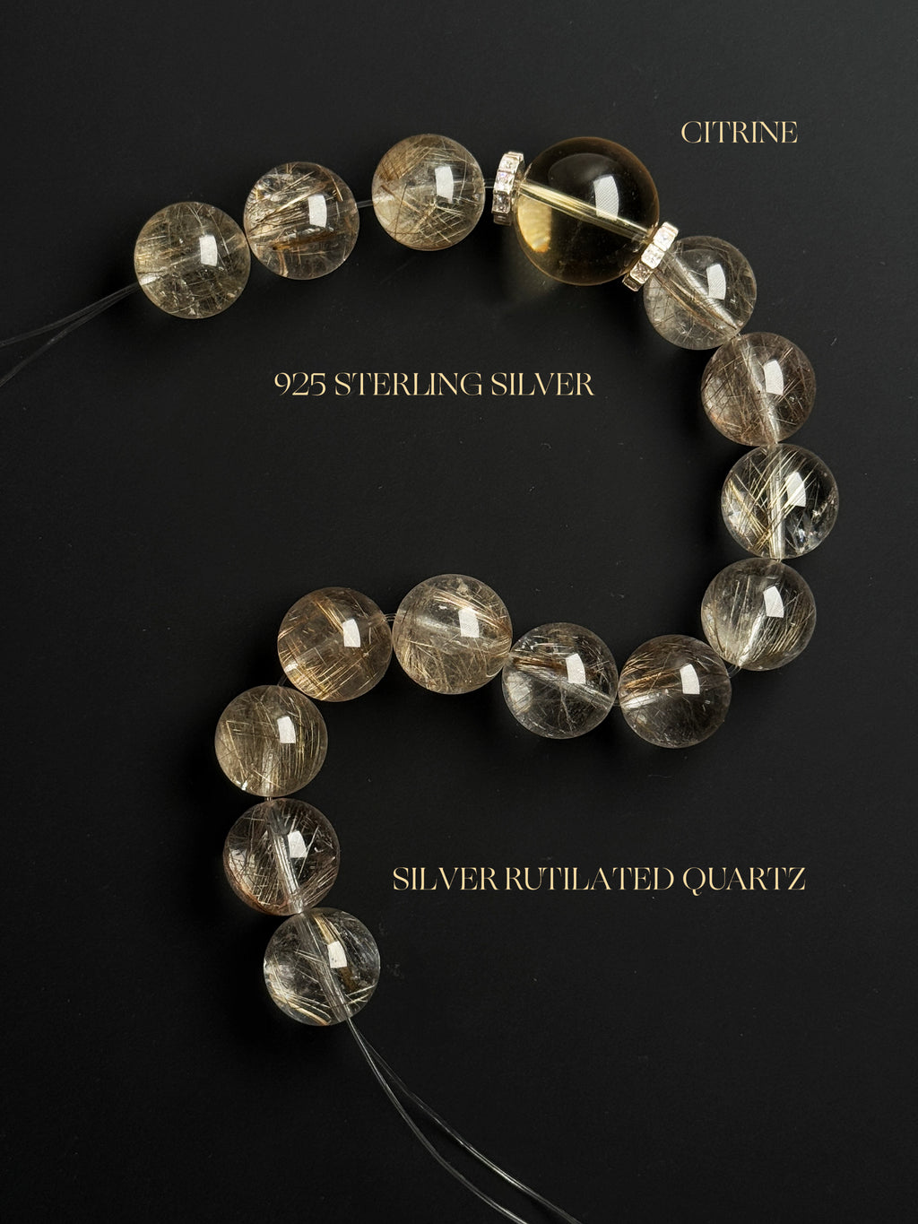  High-clarity natural silver rutilated quartz and collector-grade citrine bracelet displayed on a black background, highlighting the natural mineral inclusions, crystal clarity, and 925 sterling silver accents.