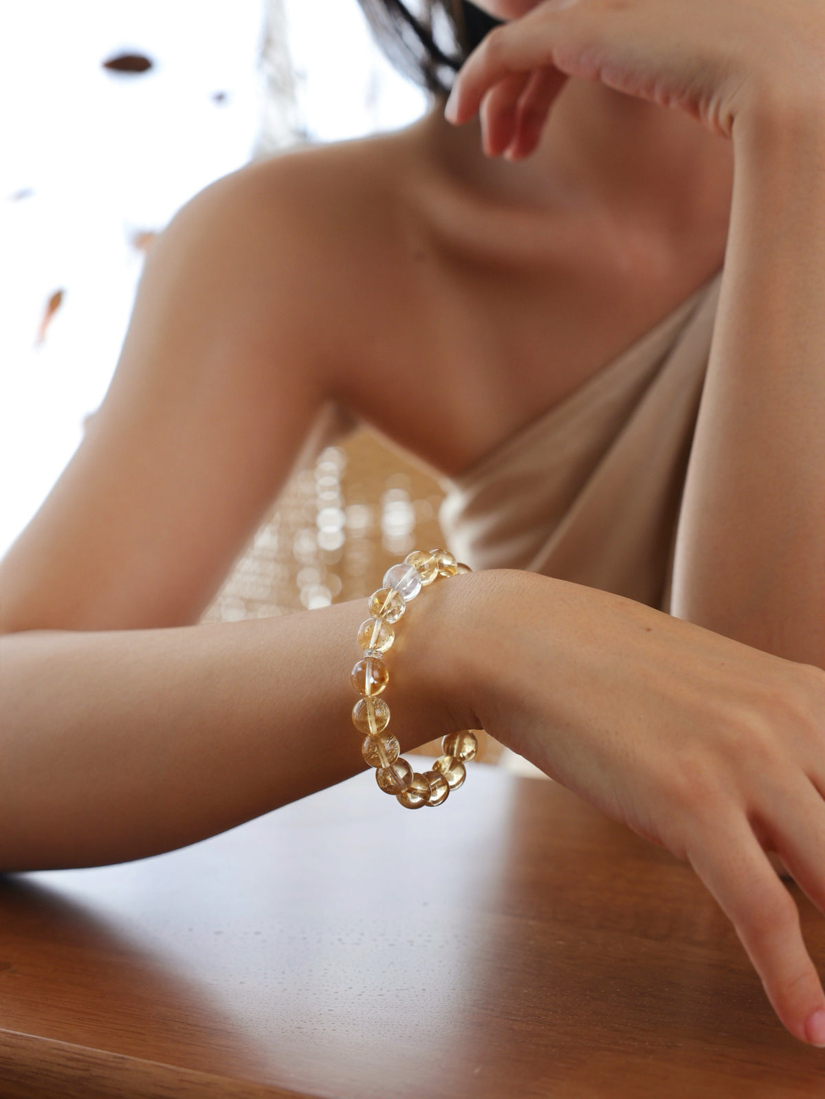 High-Rainbow Citrine and Blue Needle Quartz bracelet worn on wrist