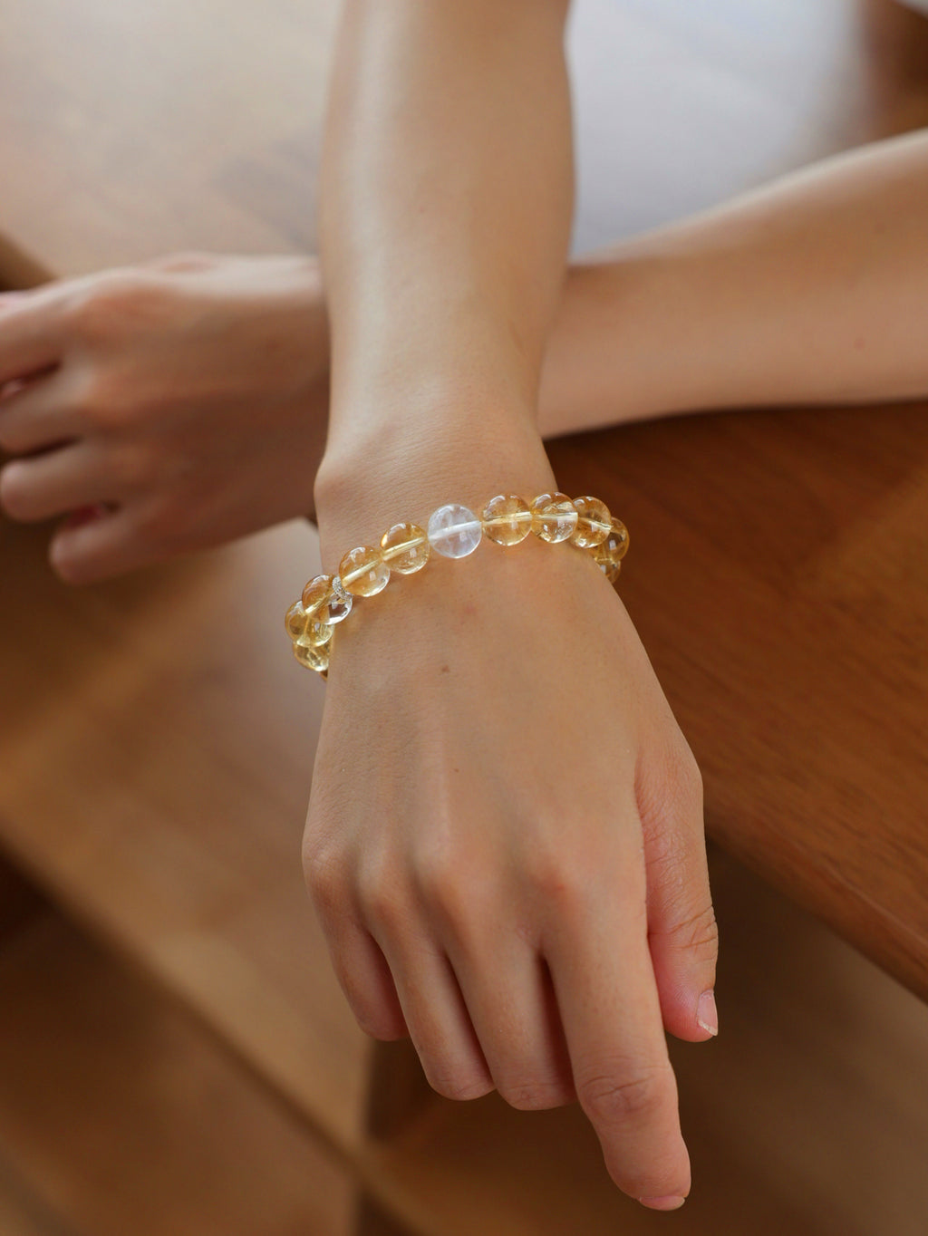 High-Rainbow Citrine and Blue Needle Quartz bracelet worn on wrist