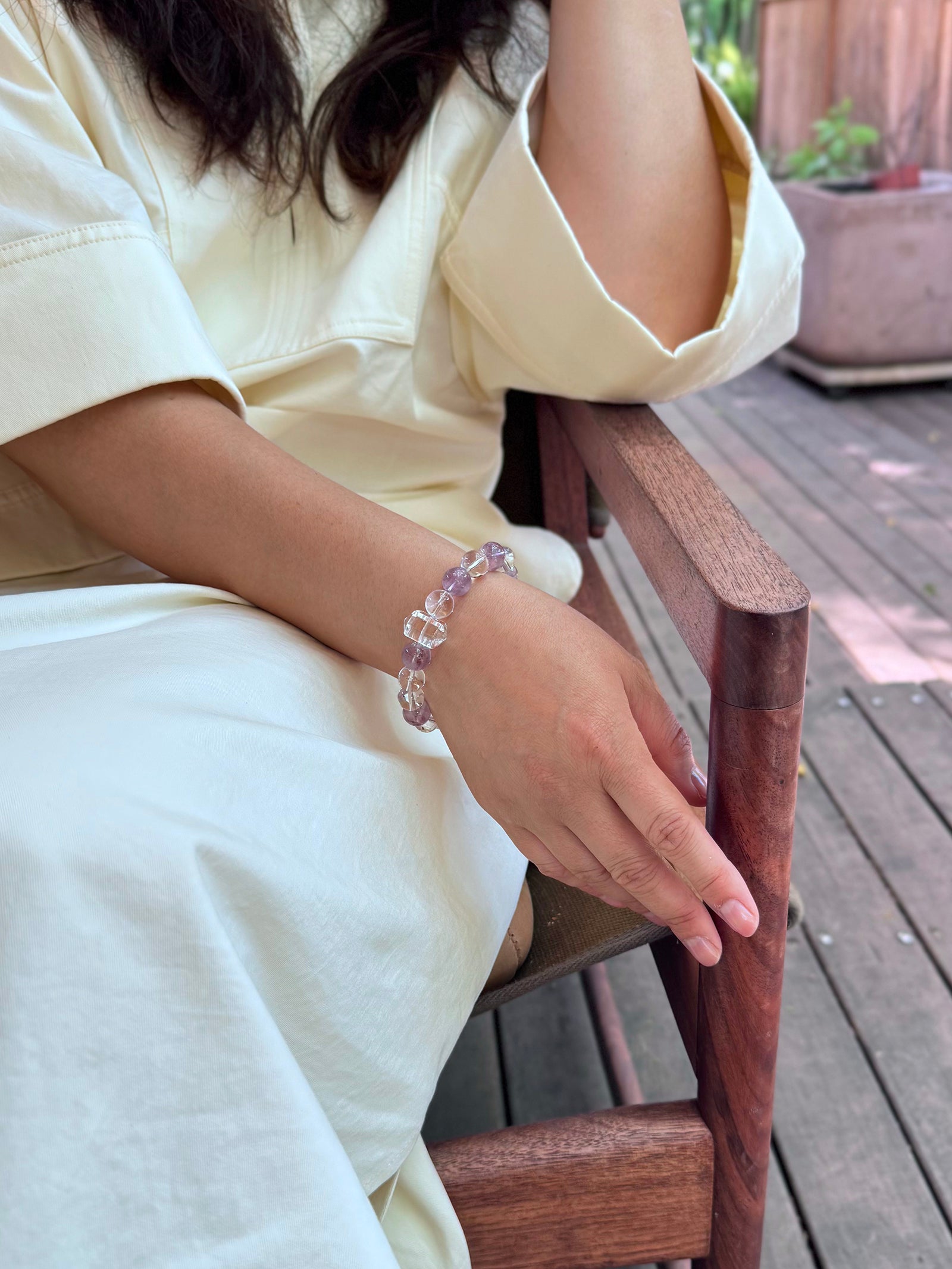 Himalayan clear quartz and amethyst bracelet worn in a relaxed lifestyle setting for inner clarity and calm focus