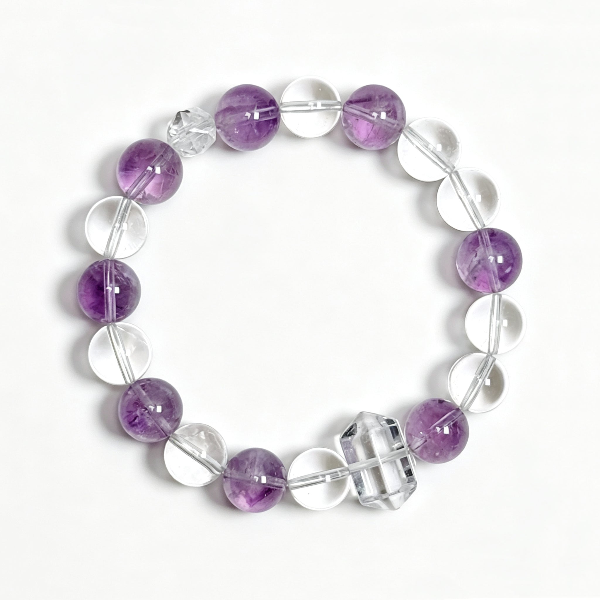 Top view of Himalayan clear quartz and amethyst bracelet showing full bead arrangement for intuition and calm focus