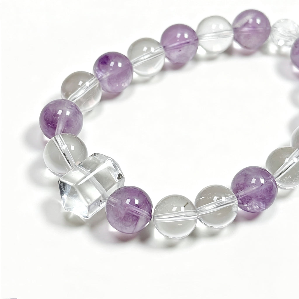 Close-up detail of Himalayan clear quartz and amethyst bracelet showing natural icy textures and soft lavender tones for inner clarity