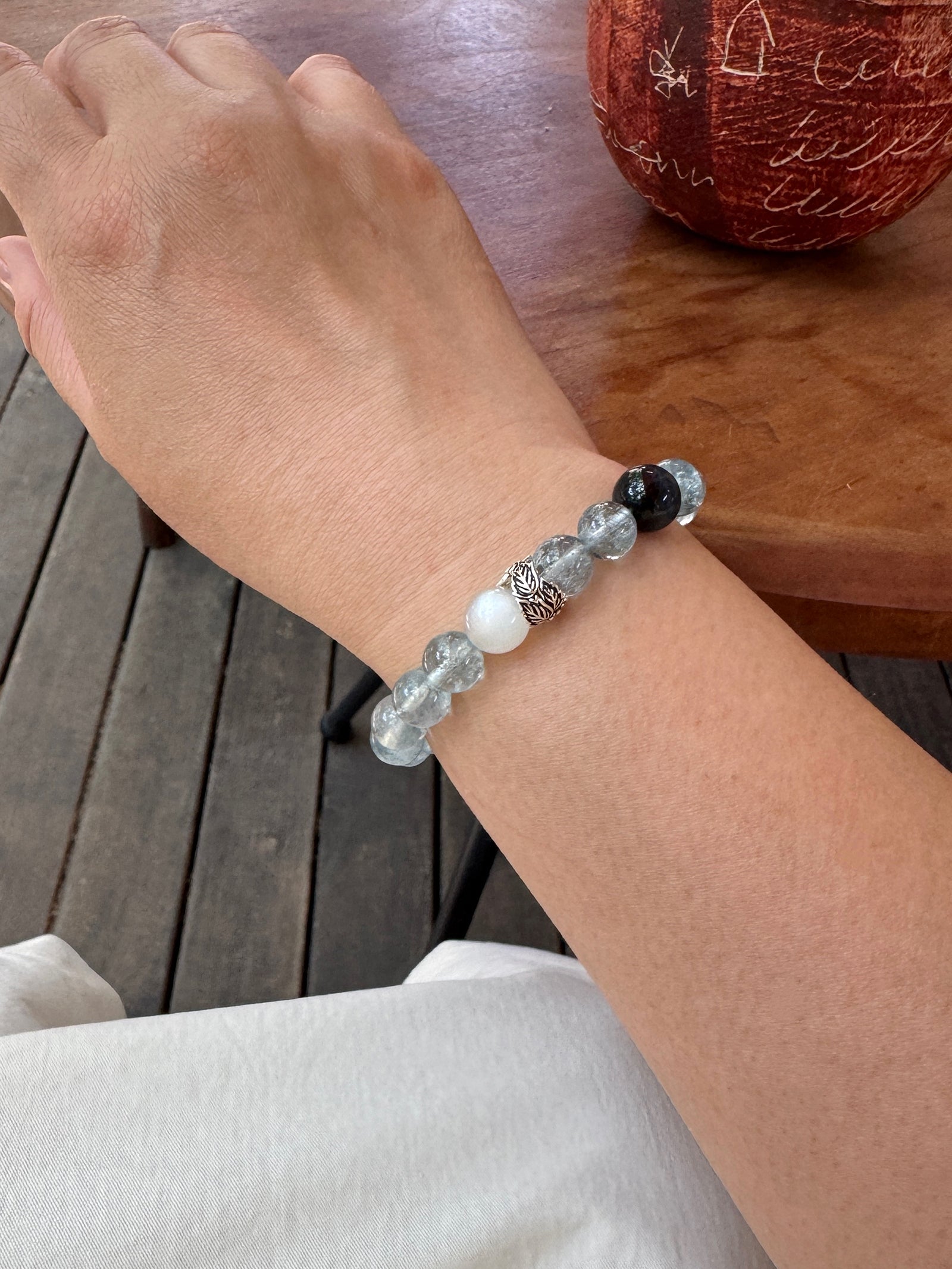 Included Aquamarine crystal bracelet worn on wrist close-up showing natural texture and fit