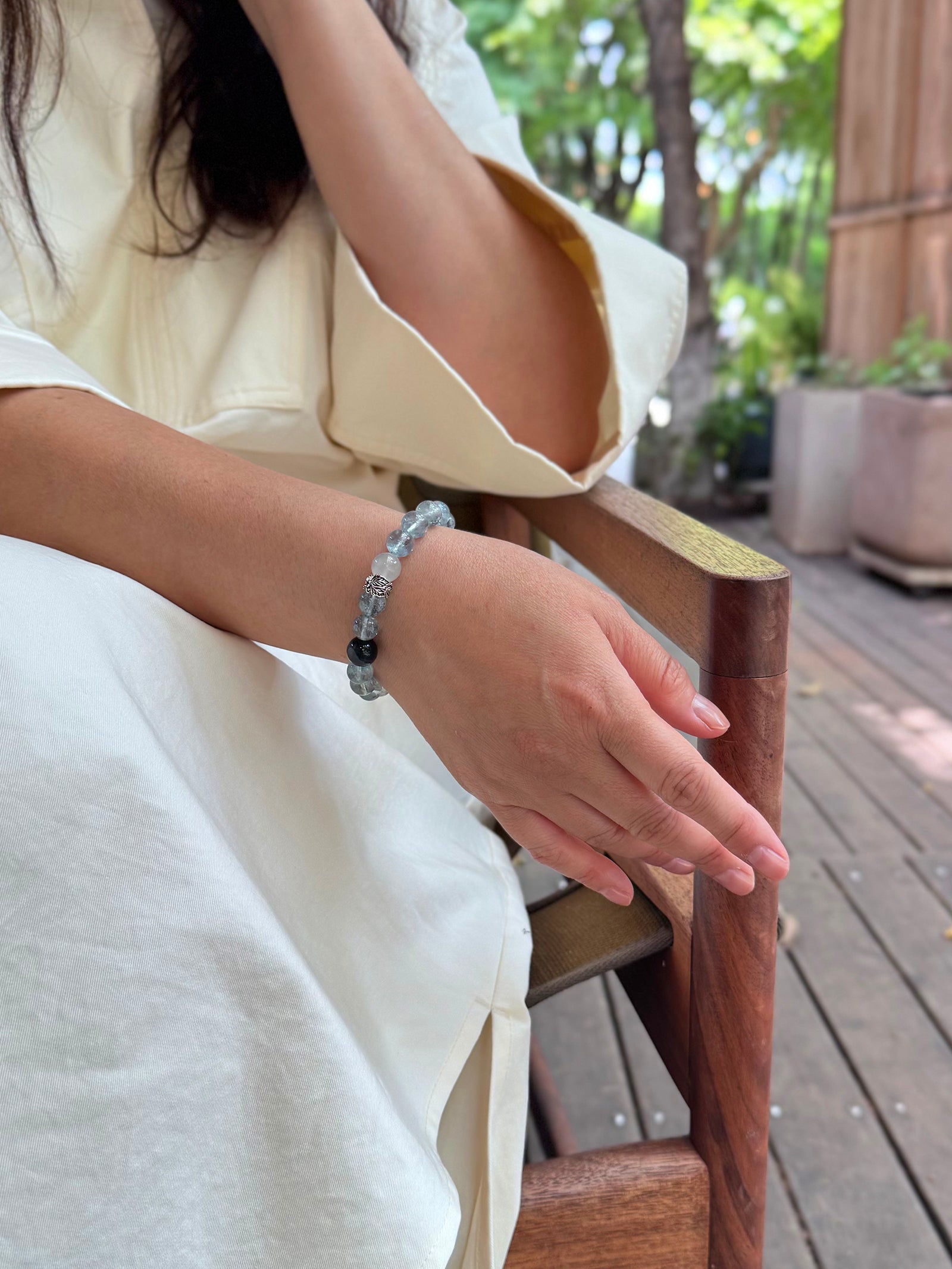 Included Aquamarine bracelet worn naturally in a calm and grounded lifestyle setting