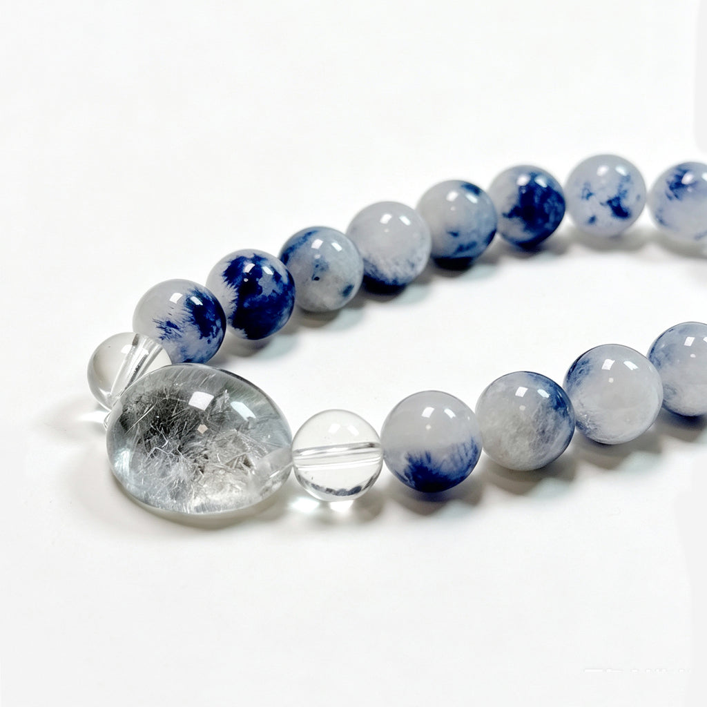 Close-up of natural Kyanite and Blue Rutilated Quartz bracelet showing unique blue inclusions and crystal details