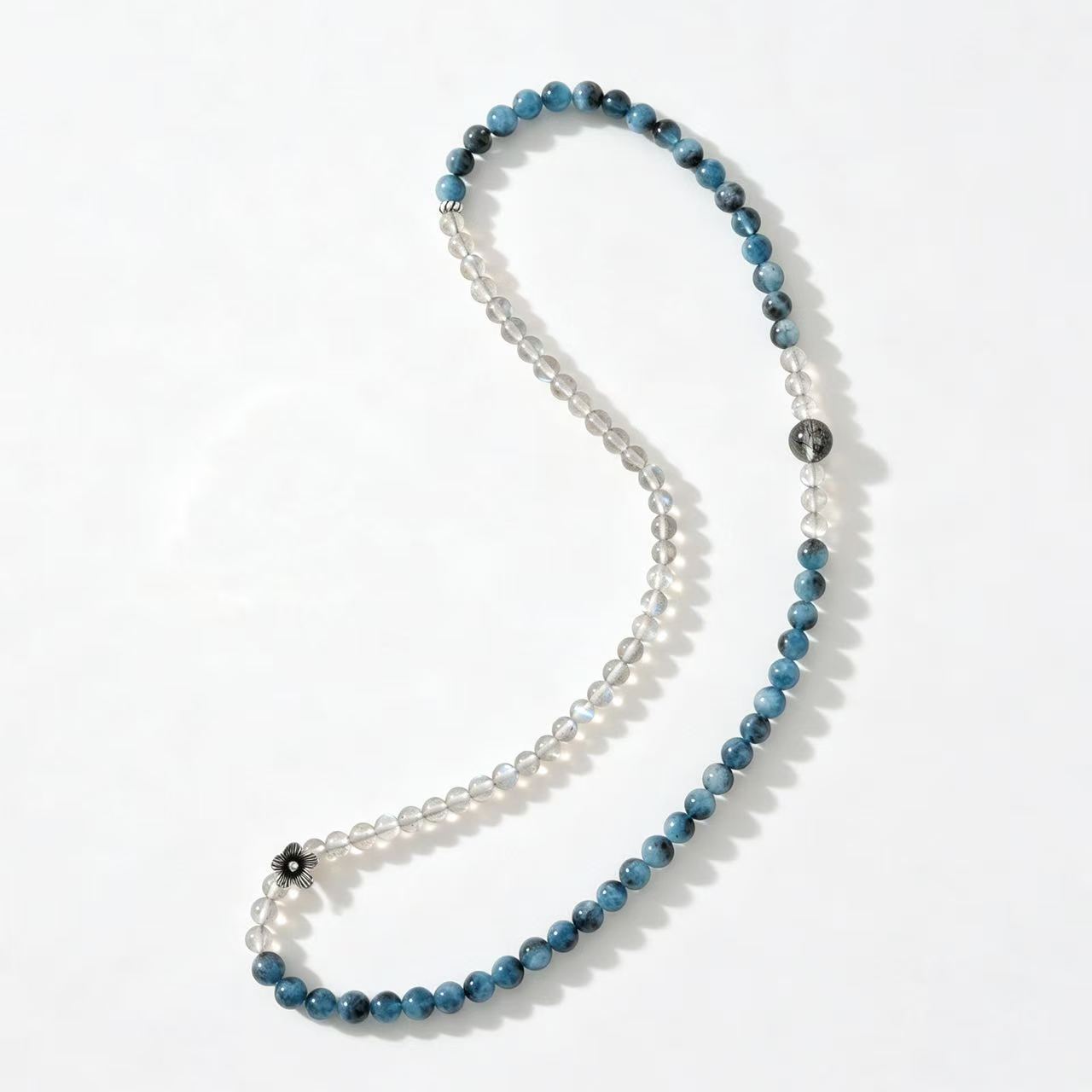 Top view of labradorite and aquamarine wrap bracelet showing layered bead arrangement and natural mineral textures