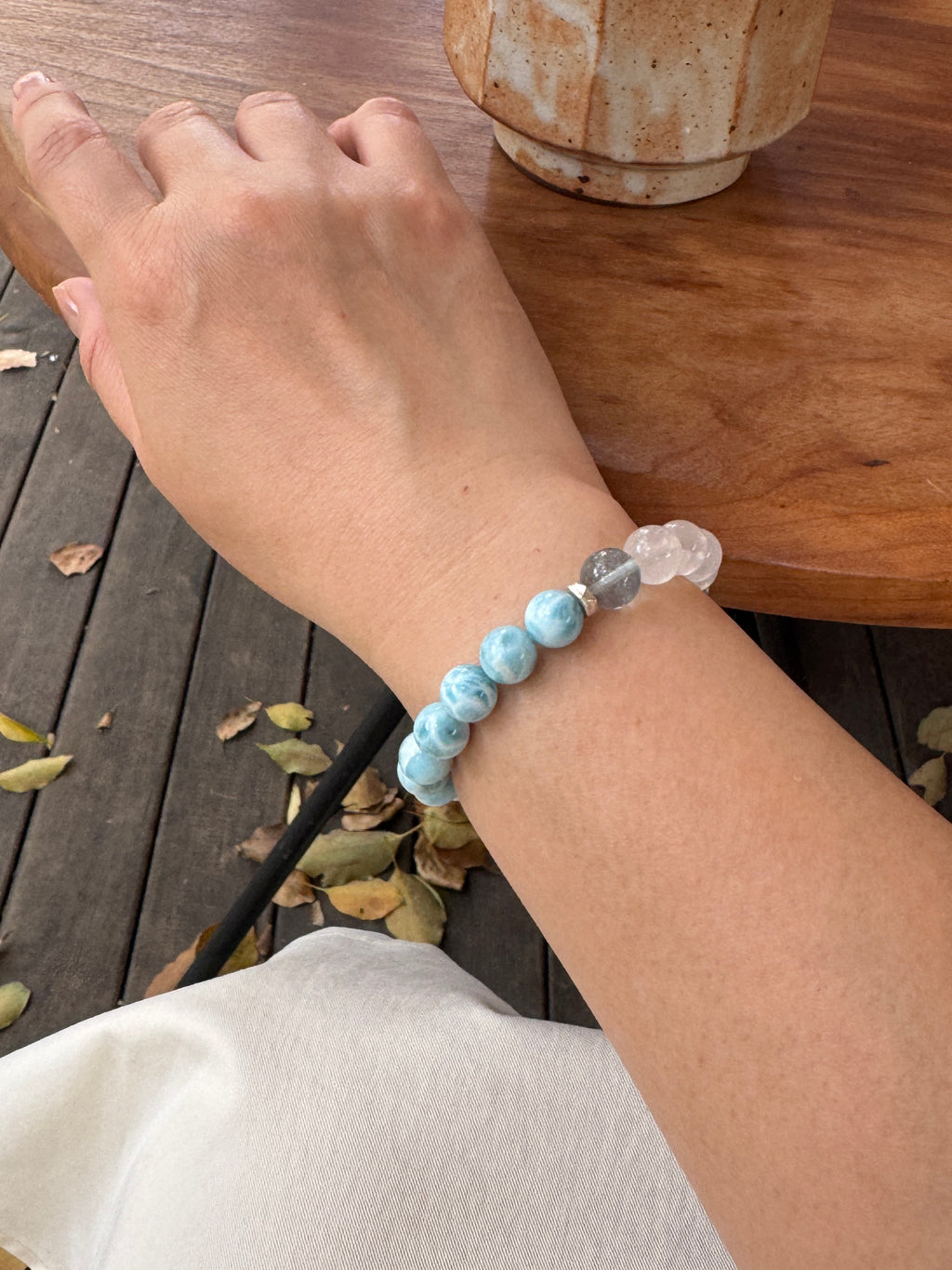 Larimar crystal bracelet worn on wrist close-up showing size and fit
