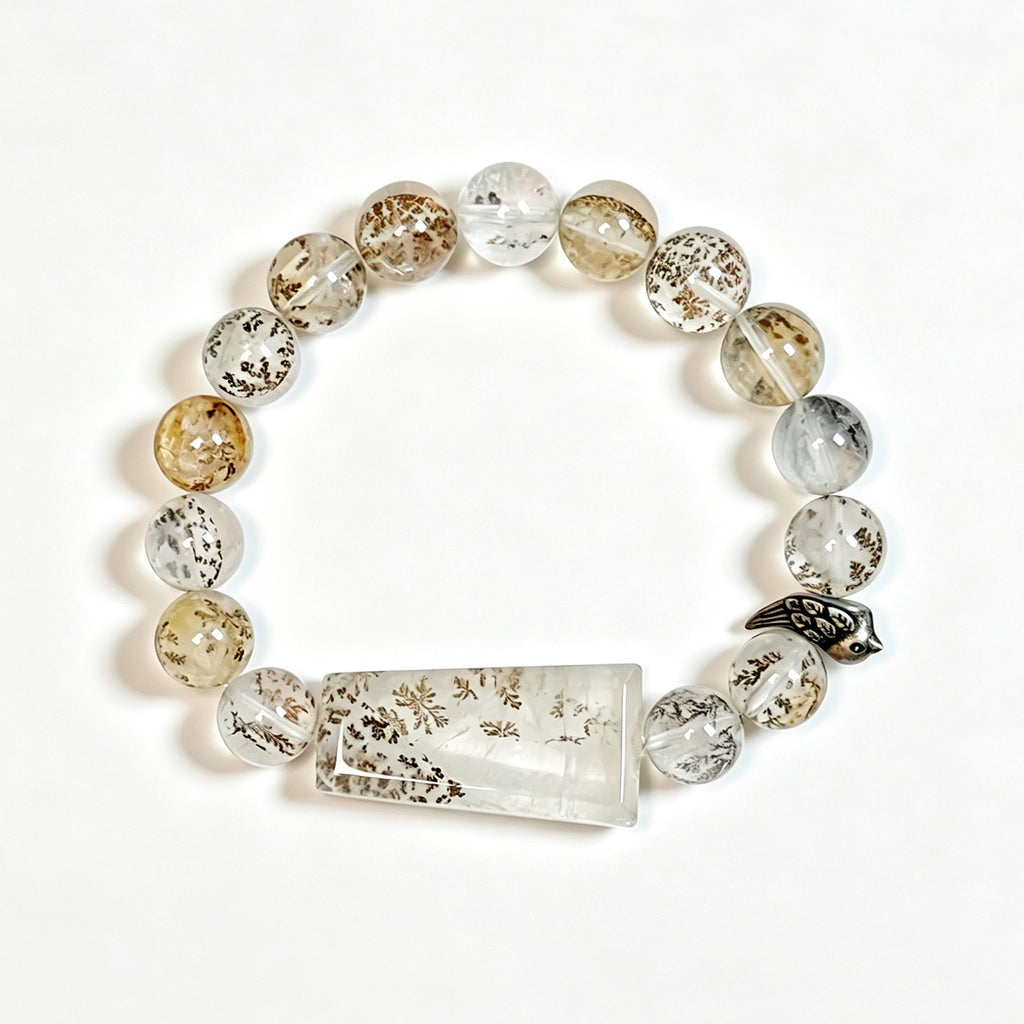 One of a Kind Dendritic Quartz bracelet featuring natural tree-like inclusions and sterling silver bird charm