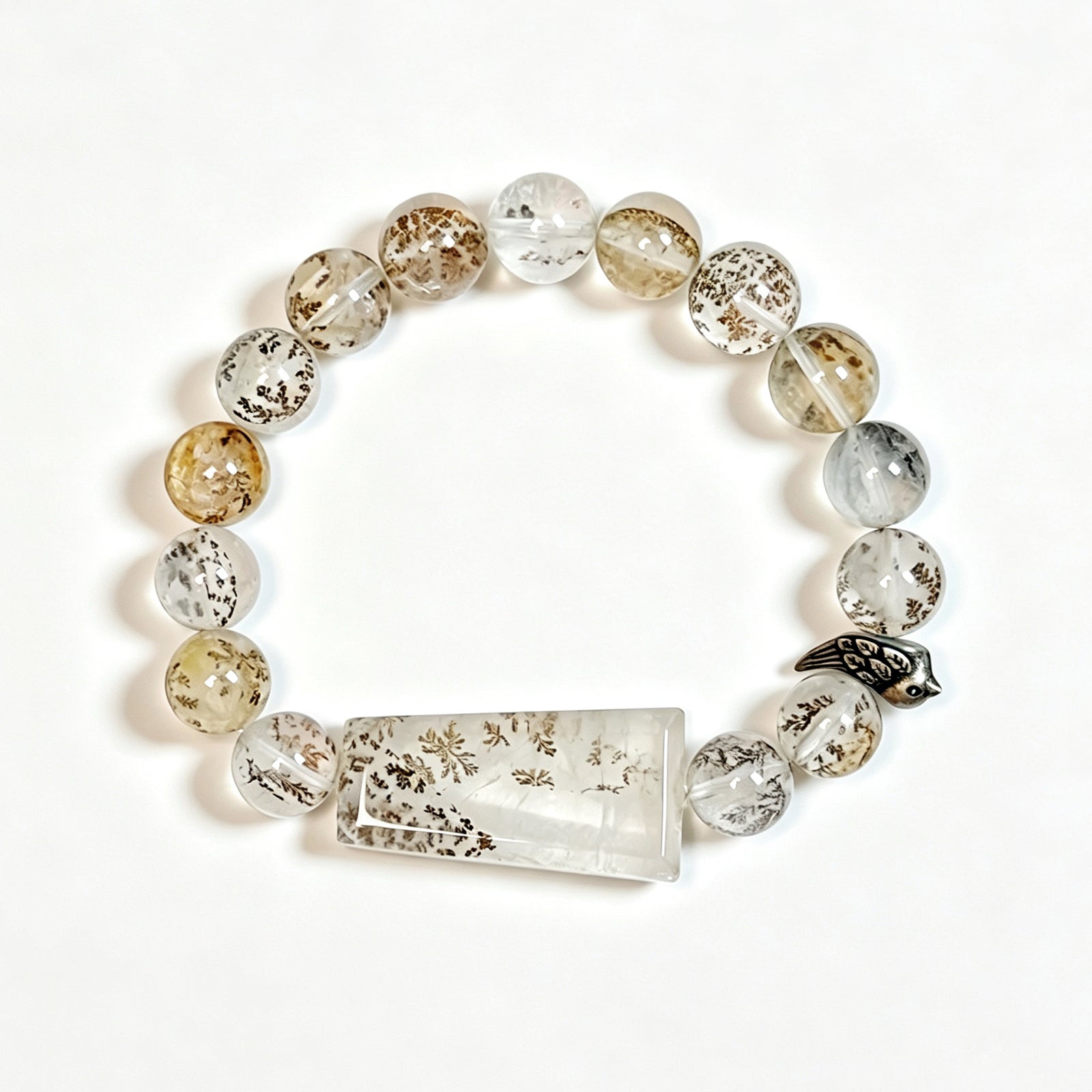 One of a Kind Dendritic Quartz bracelet featuring natural tree-like inclusions and sterling silver bird charm