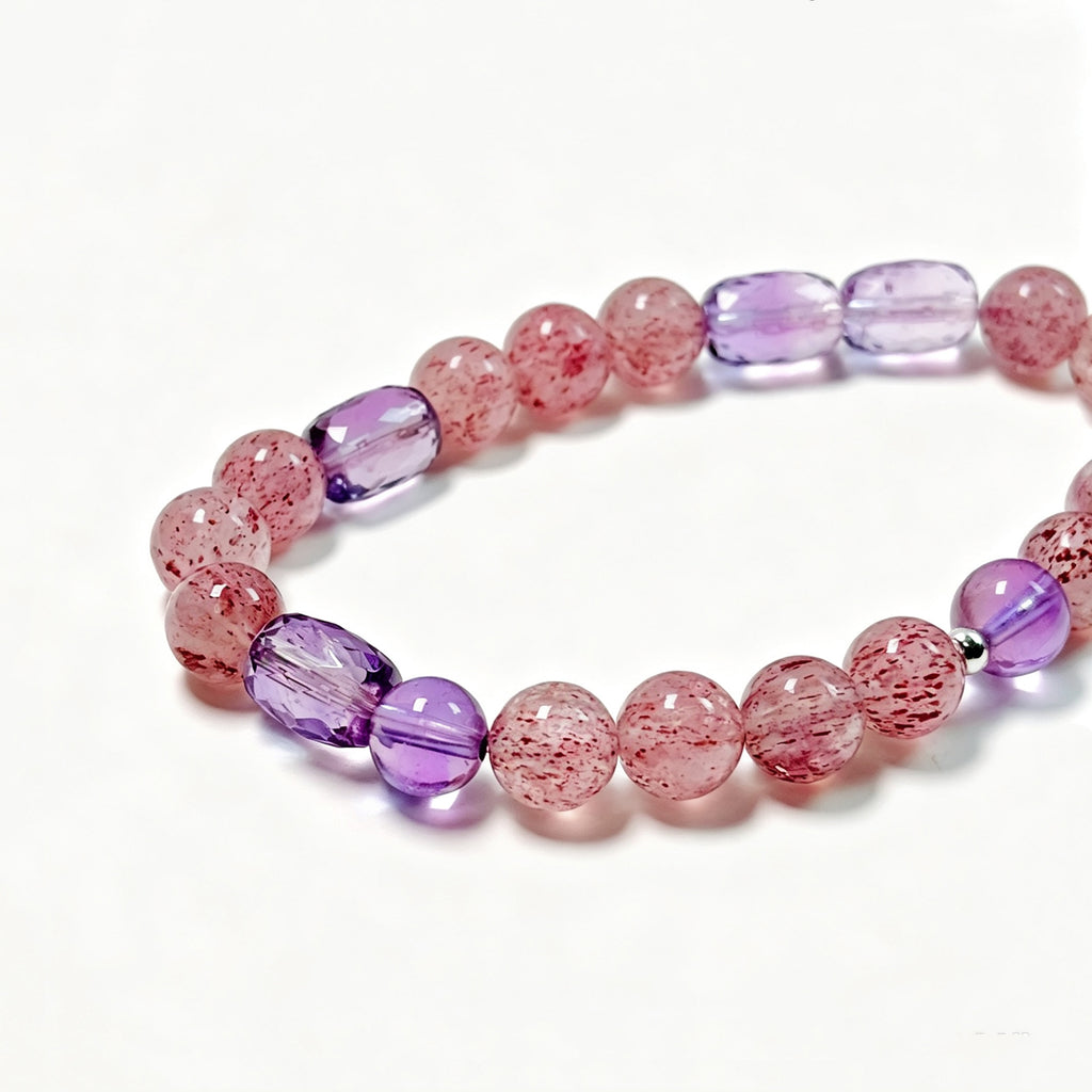 Close-up detail of natural Pale Strawberry Quartz, Amethyst and 925 Sterling Silver bracelet
