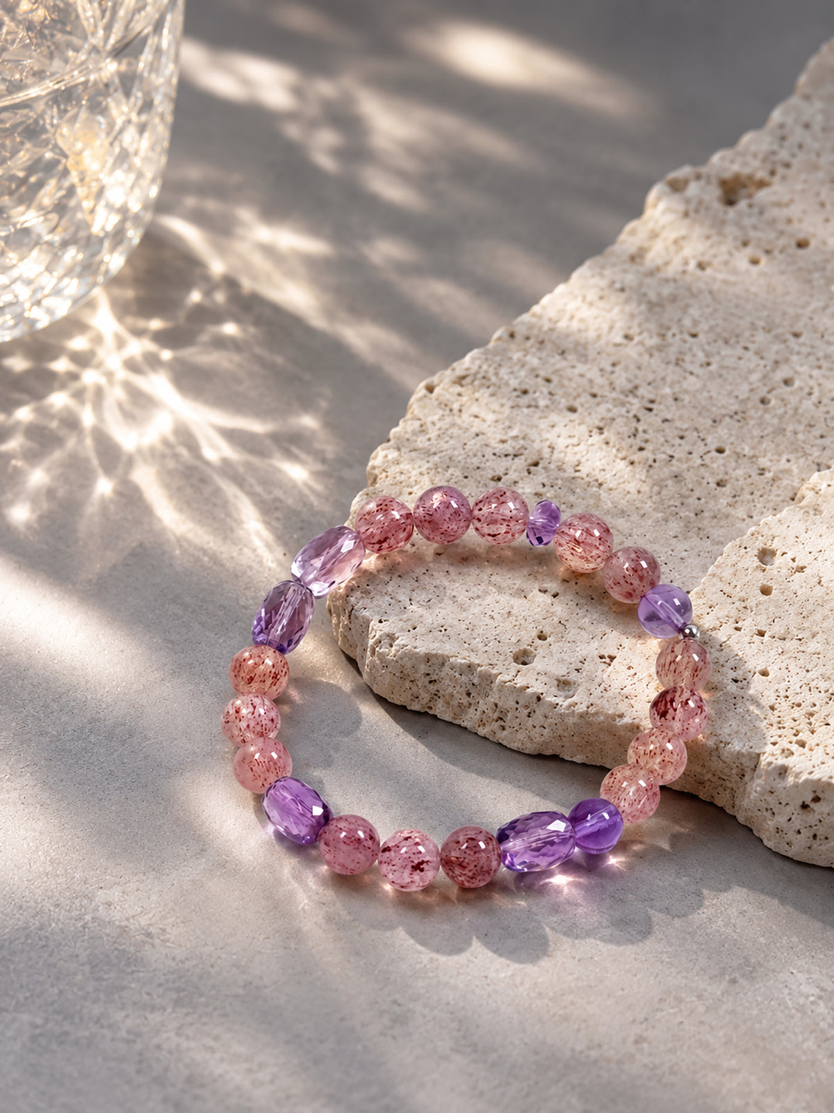 Pale Strawberry Quartz and Amethyst bracelet representing love, emotional healing and inner awareness