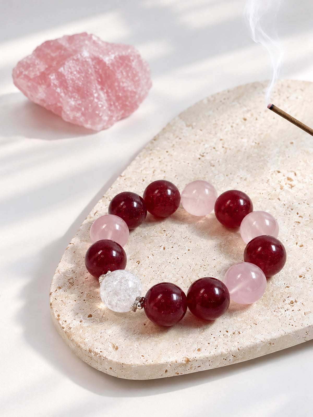 Pink Giant natural undyed Strawberry Quartz, Rose Quartz and Rainbow Clear Quartz bracelet with 925 sterling silver in a refined lifestyle setting.
