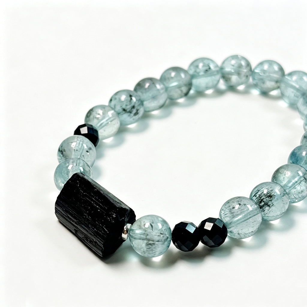  Close-up detail of rare green-toned Aquamarine, raw Black Tourmaline and faceted Black Spinel bracelet