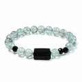 Side view of rare green-toned Aquamarine bracelet with raw Black Tourmaline and Black Spinel