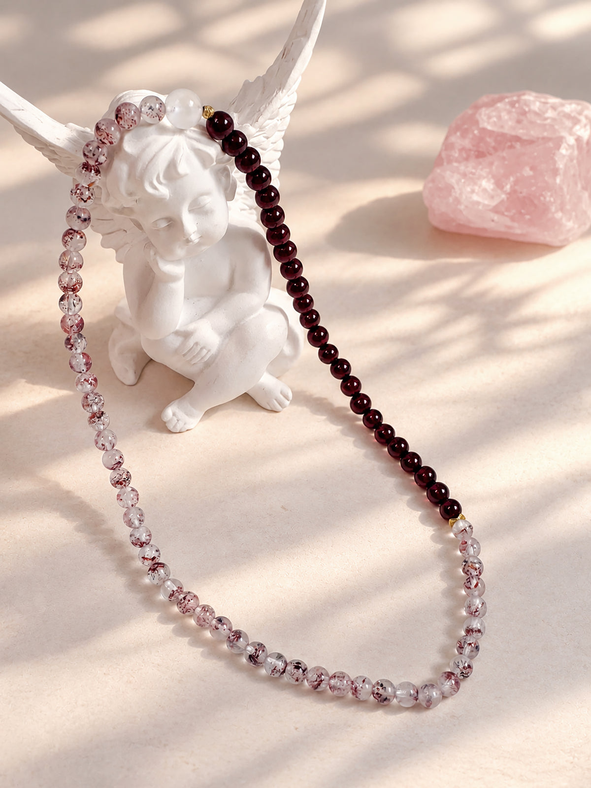 Vintage-inspired Red Super Seven Quartz, Garnet and Moonstone double-wrap bracelet styled in an elegant jewelry setting with warm, romantic details.