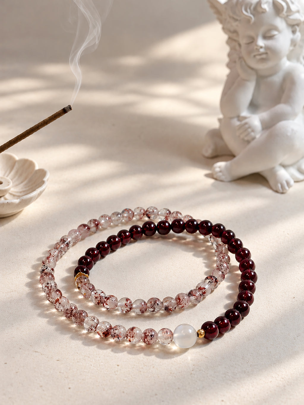 Vintage-inspired Red Super Seven Quartz, Garnet and Moonstone double-wrap bracelet styled in an elegant jewelry setting with warm, romantic details.