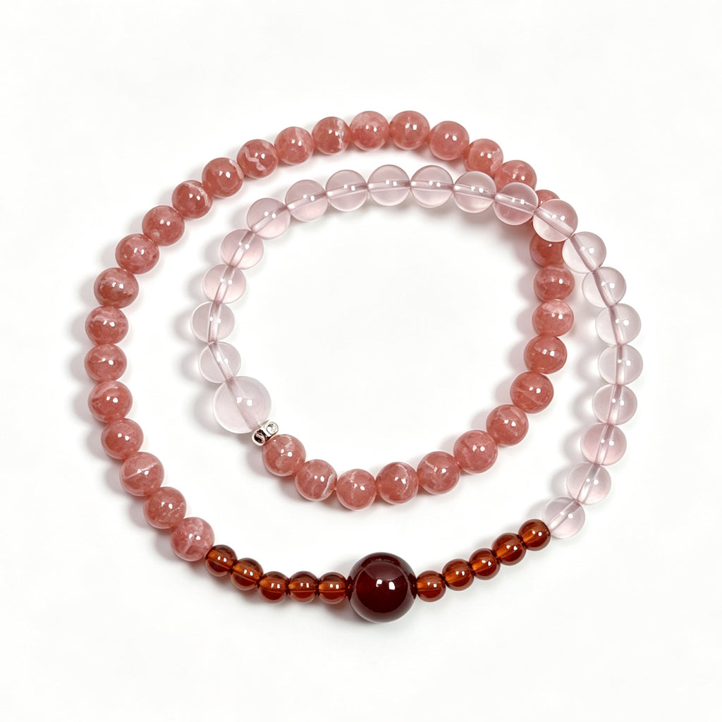 Top view of Rhodochrosite and Star Rose Quartz bracelet showing full bead arrangement
